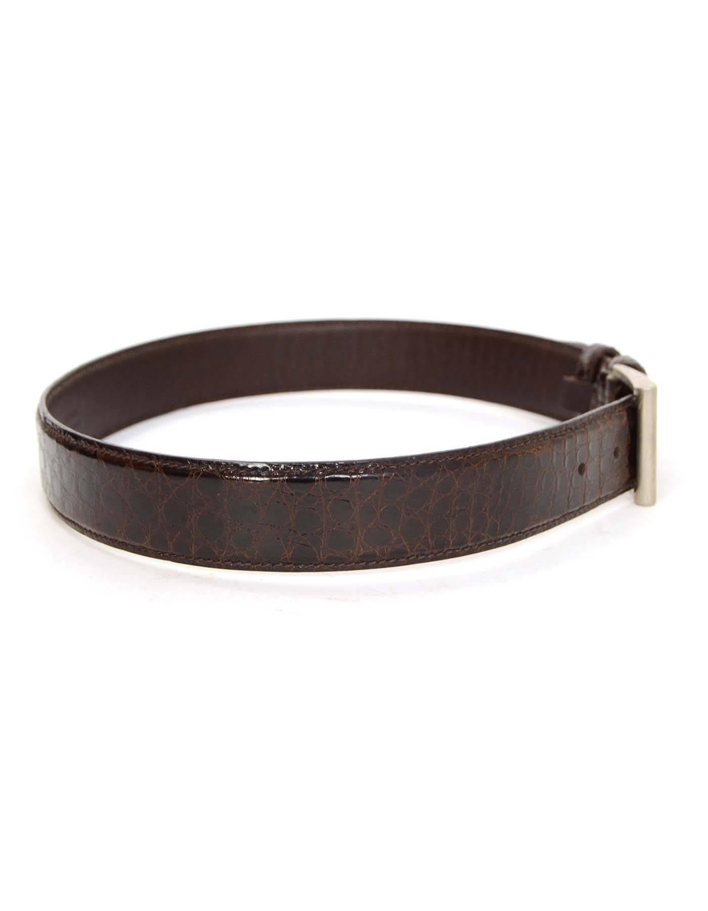 Prada Brown Crocodile Belt sz 75

Made In: Italy
Color: Brown
Hardware: Silvertone
Materials: Crocodile 
Closure/Opening: Buckle and notch closure
Overall Condition: Excellent pre-owned condition
Includes: Prada dust bag
Marked Size: