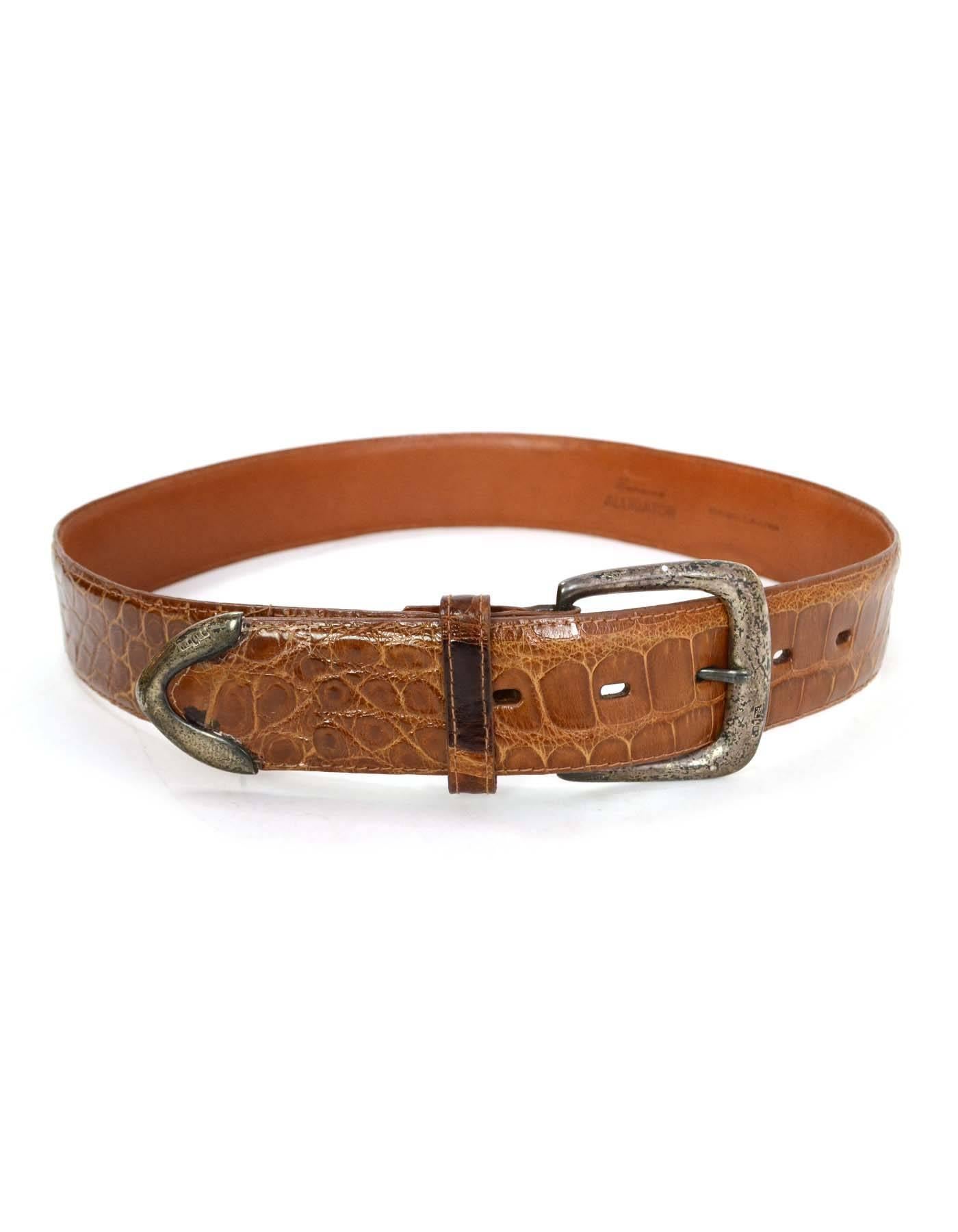 Ralph Lauren Brown Alligator Belt sz 28
Features distressed sterling silver buckle
Color: Brown
Hardware: Sterling silver
Materials: Alligator
Closure/Opening: Buckle and notch closure
Overall Condition: Excellent pre-owned condition with the