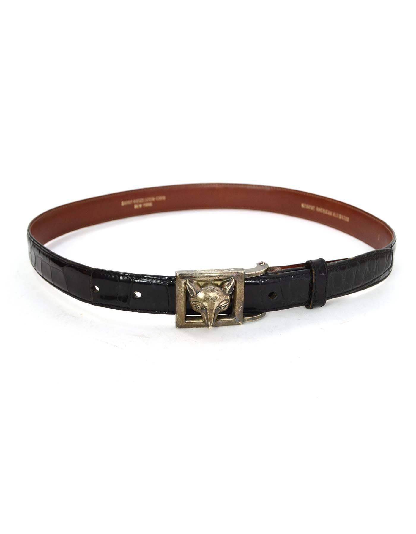 Kieselstein-Cord Alligator Skin Belt 
Features sterling wolf head belt buckle
Year of Production: 1996
Color: Black, brown and silver
Hardware: Sterling silver
Materials: Alligator skin, leather and sterling silver
Closure/Opening: Stud and