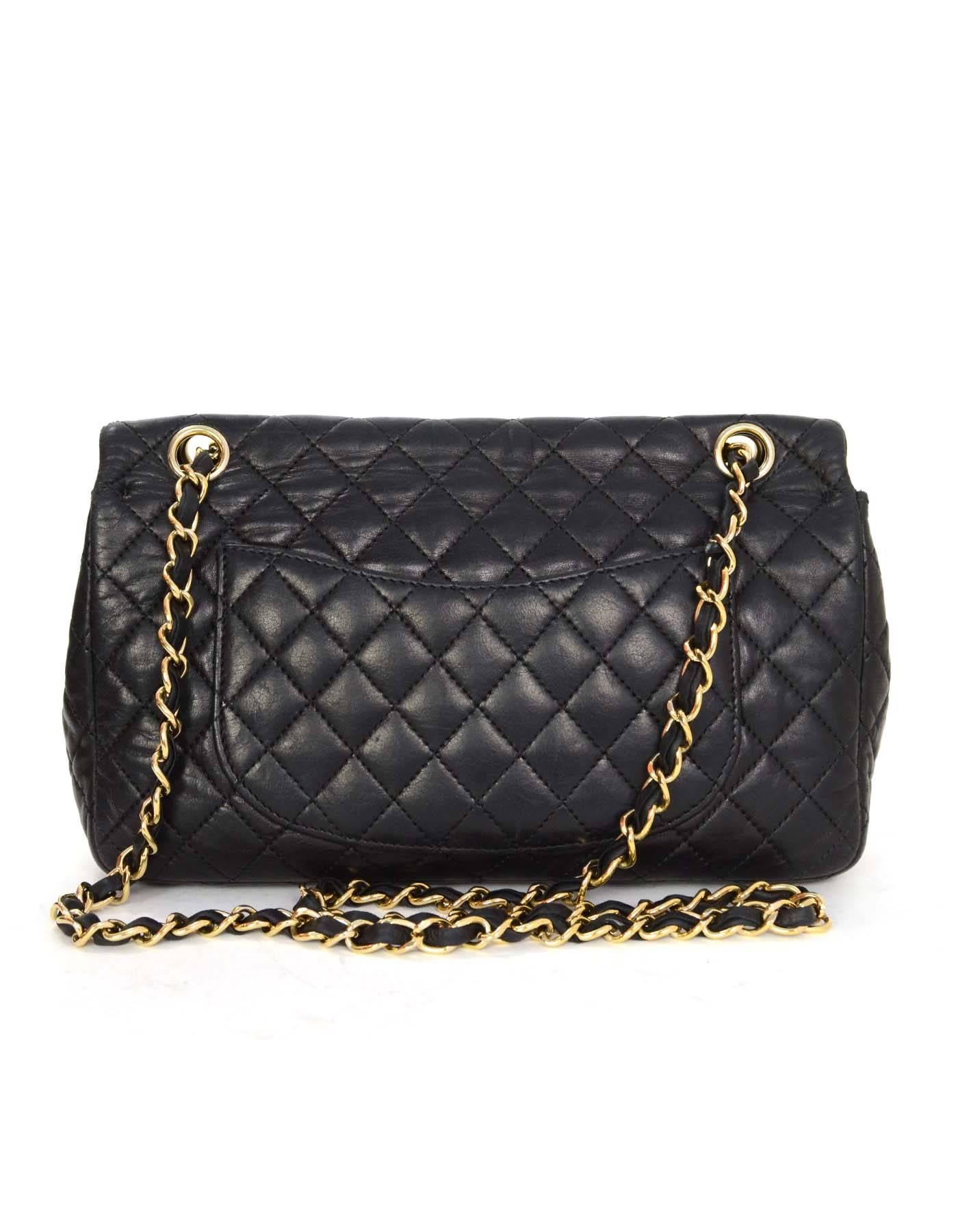 Chanel Black Quilted Valentine Charm Flap Bag 
Features five different heart charms on chain link shoulder strap
Made In: Italy
Year of Production: 2010
Color: Black
Hardware: Goldtone
Materials: Lambskin
Lining: Black