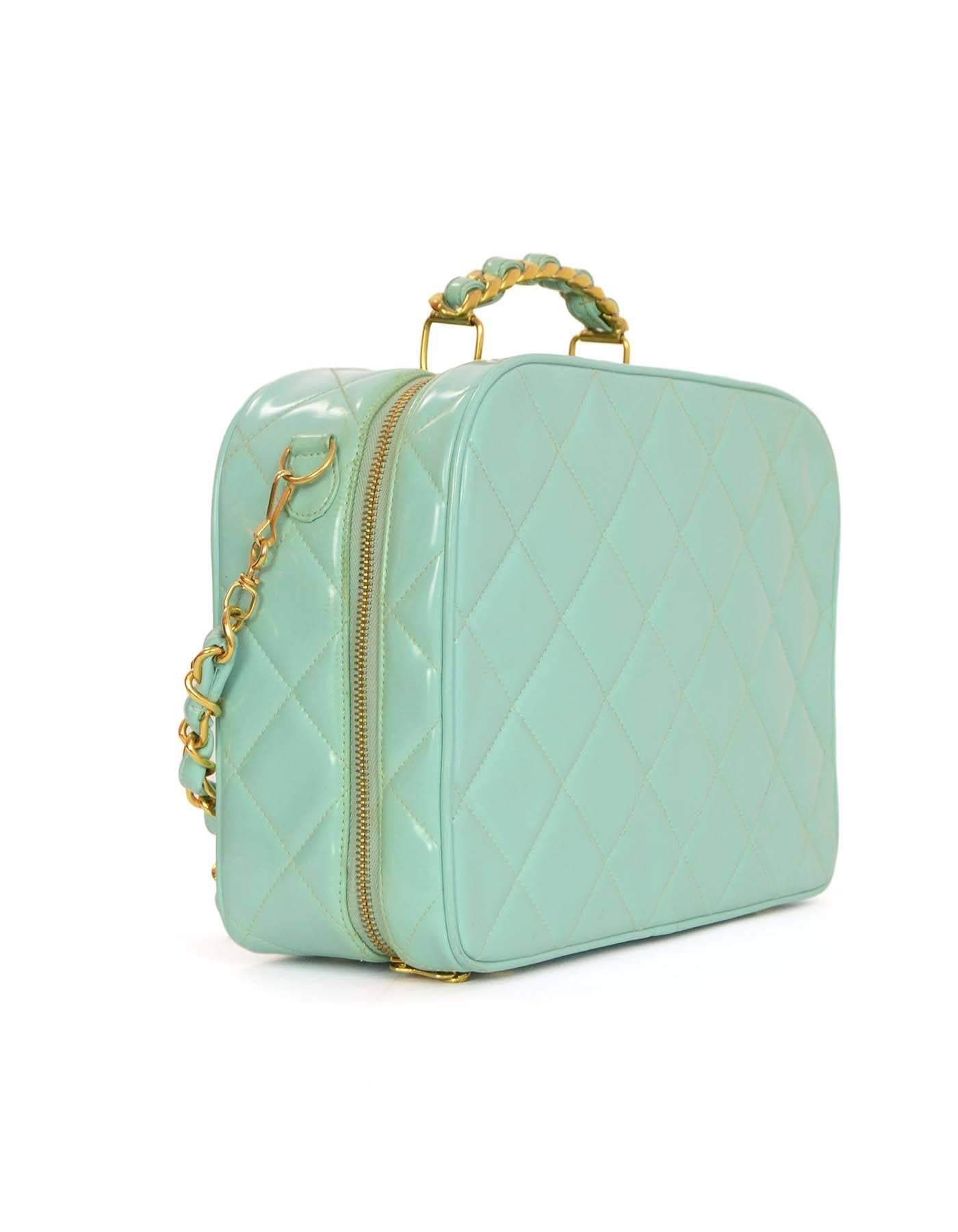 Chanel Quilted Patent Vanity Bag 
Features optional teal patent leather woven chain link shoulder strap
Made In: France
Year of Production: 1994-1996
Color: Teal
Hardware: Goldtone
Materials: Patent leather
Lining: Teal