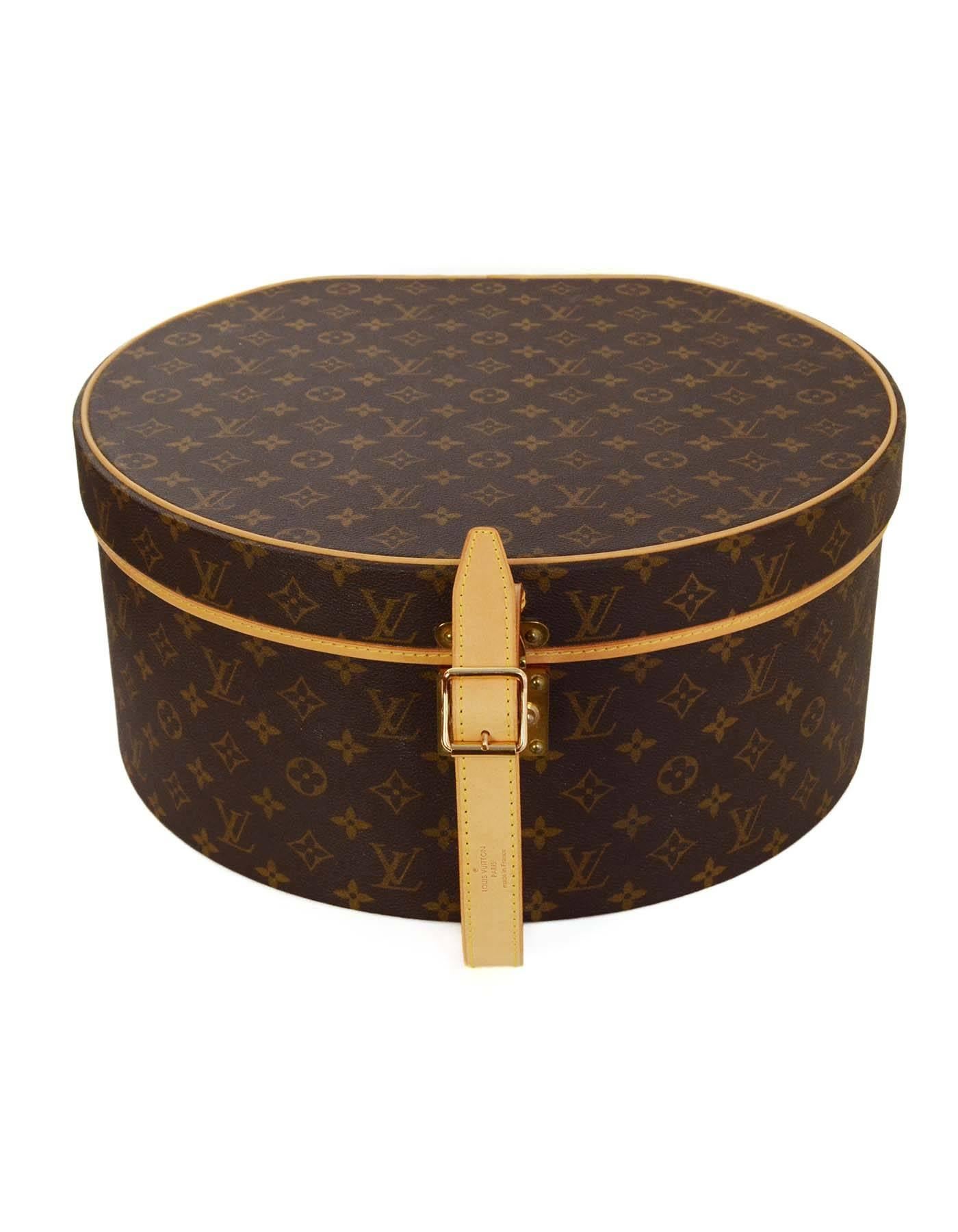 Louis Vuitton Monogram 40cm Boite Chapeaux Ronde Hat Box 
Features leather handle/strap and leather piping throughout
Made In: France
Year of Production: 2007
Color: Brown and tan
Hardware: Goldtone
Materials: Coated canvas and