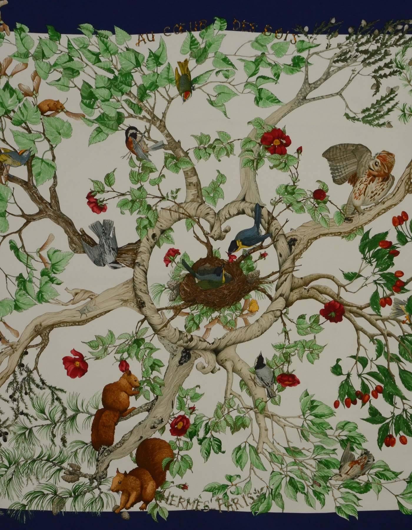 Hermes Blue Multi-Colored ' Au Coeur Des Bois' Silk 90cm Scarf
Features birds in a nest with a blue frame

Made in: France
Color: Blue multi-colored
Composition: 100% Silk
Overall Condition: Excellent pre-owned condition