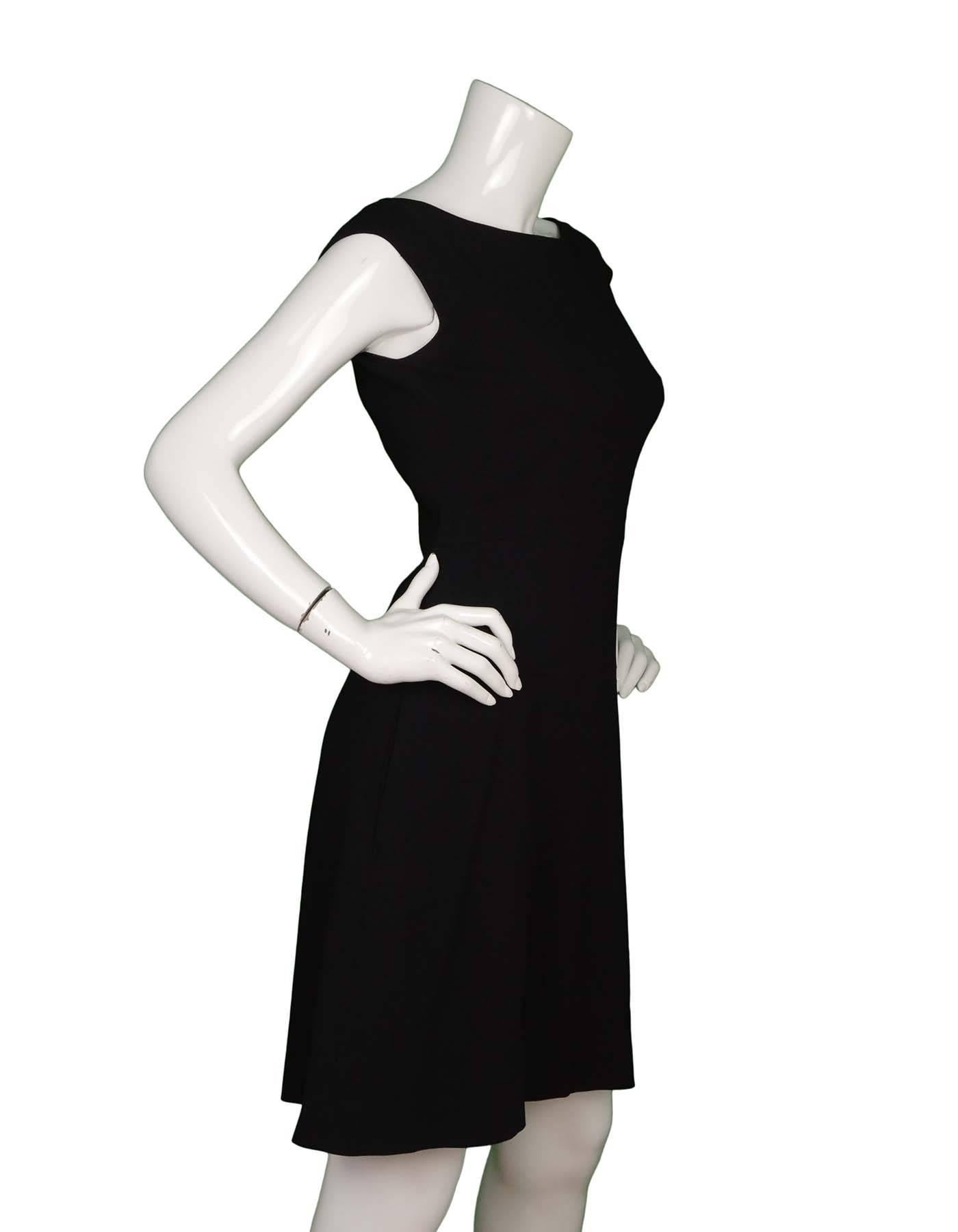 Prada Black Sleeveless A-Line Dress 
Made In: Romania
Color: Black
Composition: 98% viscose, 2% elastane
Lining: Black, 92% silk, 8% elastane
Closure/Opening: Back center zipper closure
Exterior Pockets: Two hip pockets
Interior Pockets:
