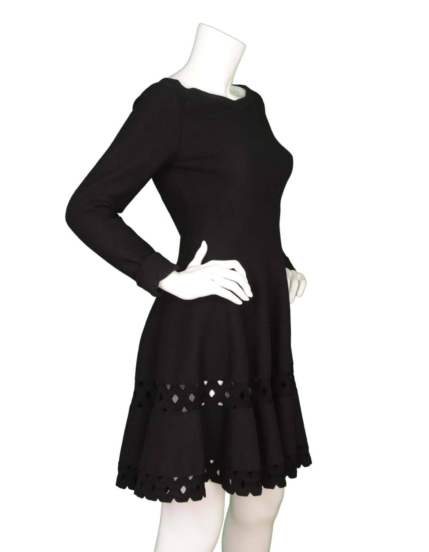 Alaia Black Wool Cut Out Long Sleeve Dress sz 42
Features cut out detailing at bottom sweep
Made In: Italy
Color: Black 
Composition: 60% Wool , 20% viscose, 10% nylon, 10% polyester
Lining: None
Closure/Opening: Center back zip