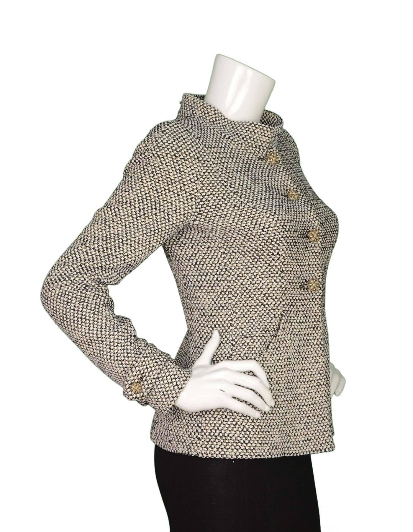 Chanel Black & White Boucle Jacket sz 36
Features decorative jeweled button with a stand collar
Made In: France
Color: Black and white 
Composition: 36% Nylon, 25% wool, 20% rayon, 10% silk, 9% polyester
Lining: Grey, 100%