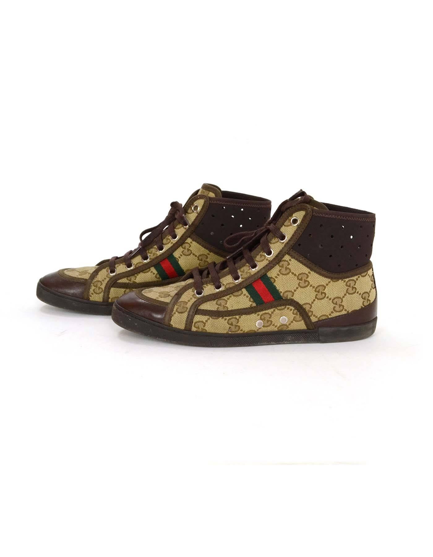 Gucci Monogram Tan & Brown High Top Sneakers sz 37.5
Features Gucci monogram throughout 
Made In: Italy
Color: Tan and brown
Materials: Leather, canvas and rubber
Closure/Opening: Lace up 
Sole Stamp: Gucci Made in Italy 
Retail Price: $450 +