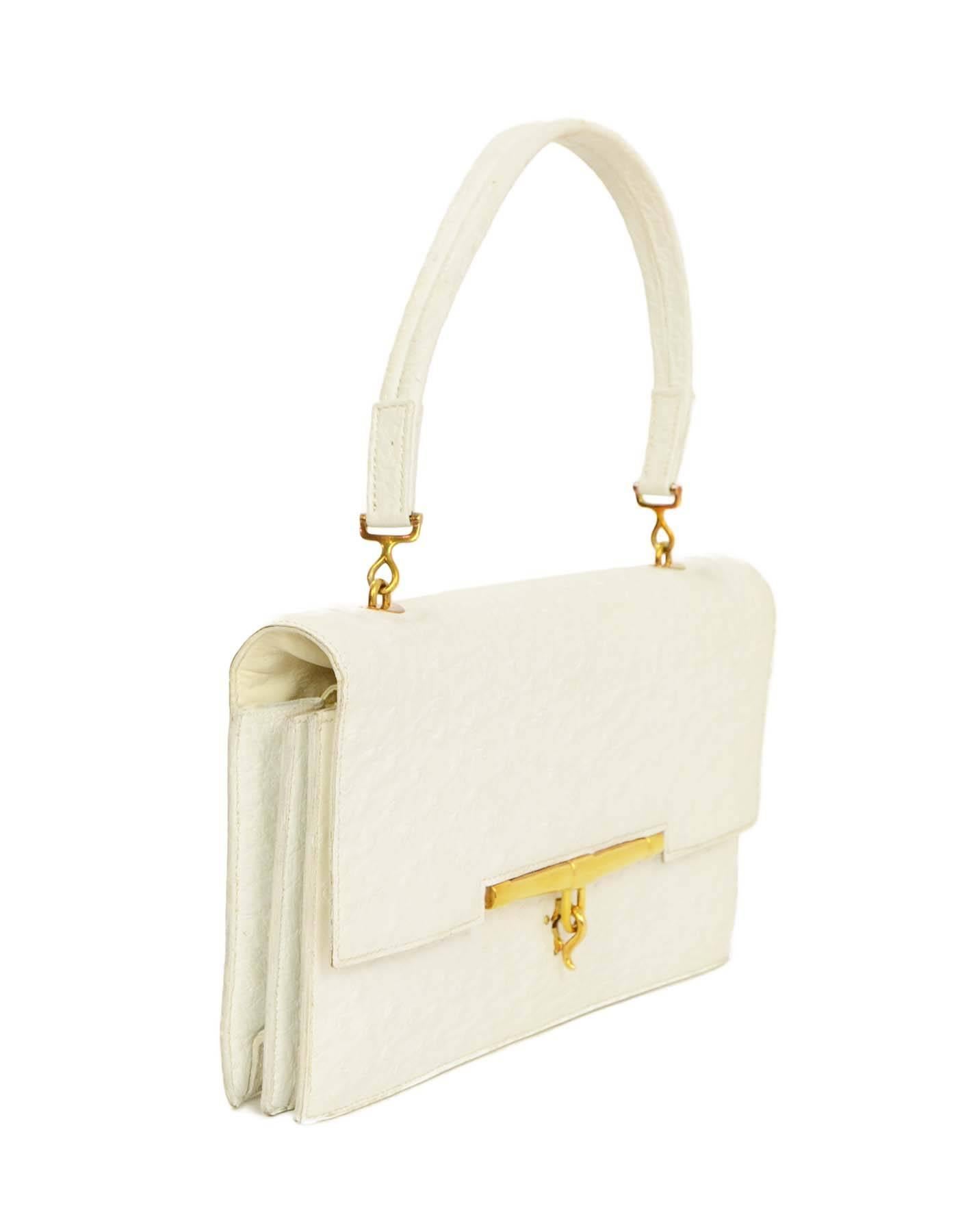 Hermes White Ostrich Piano Bag 
Made In: France
Color: White
Hardware: Goldtone
Materials: Ostrich skin
Lining: White leather
Closure/Opening: Flap top with hook lever
Exterior Pockets: None
Interior Pockets: Double gusseted with two large