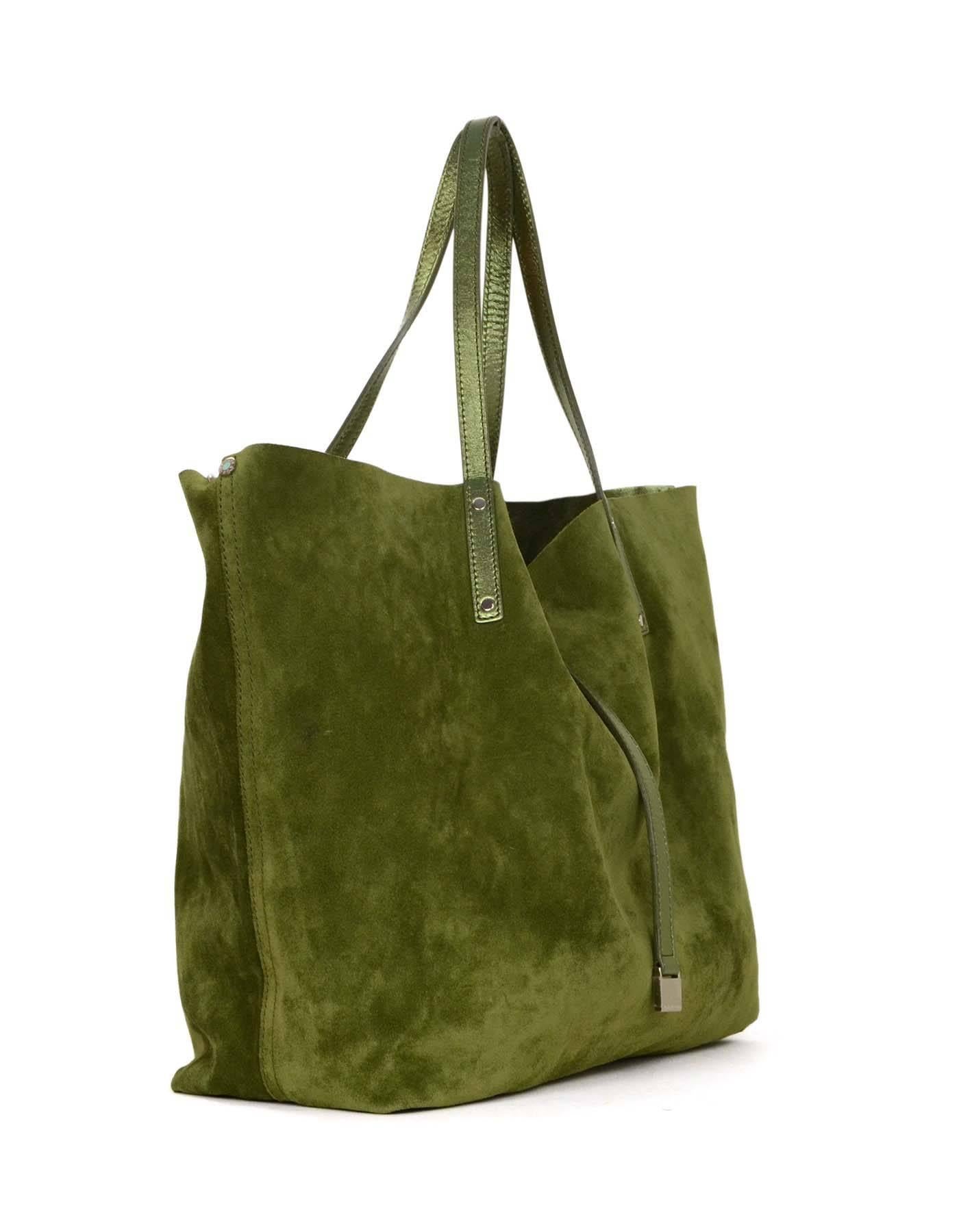 Tiffany & Co. Metallic & Army Green Reversible Tote 
Features metallic green leather on one side and army green suede on other side
Color: Metallic and army green
Hardware: Silvertone
Materials: Leather and suede
Lining: None
Closure/Opening: