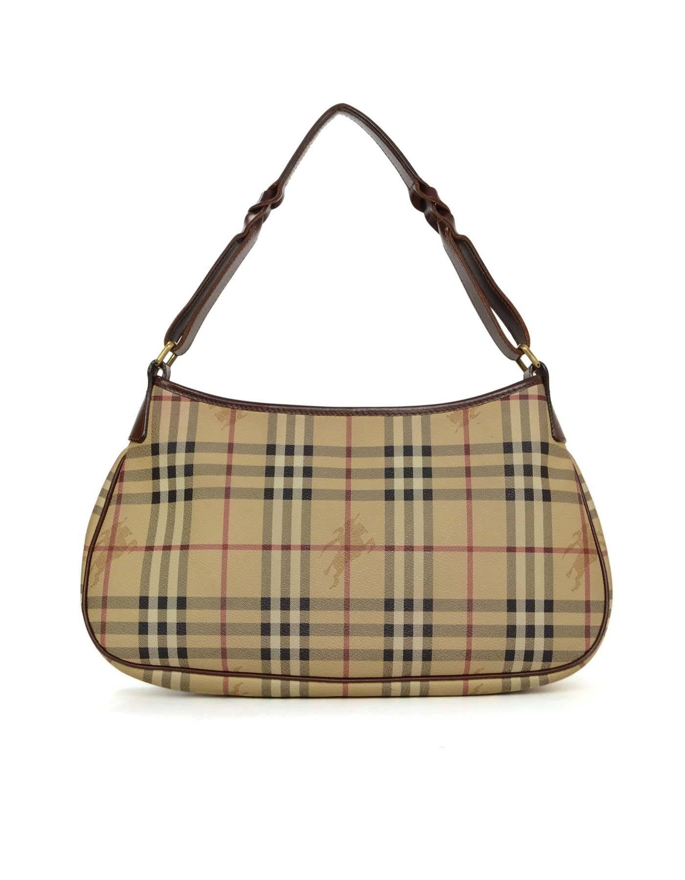 Burberry London Nova Plaid Shoulder Bag 
Features dark brown leather trim throughout exterior
Made In: Italy
Color: Dark brown, beige, black, and red
Hardware: Goldtone
Materials: Leather and coated canvas
Lining: Black