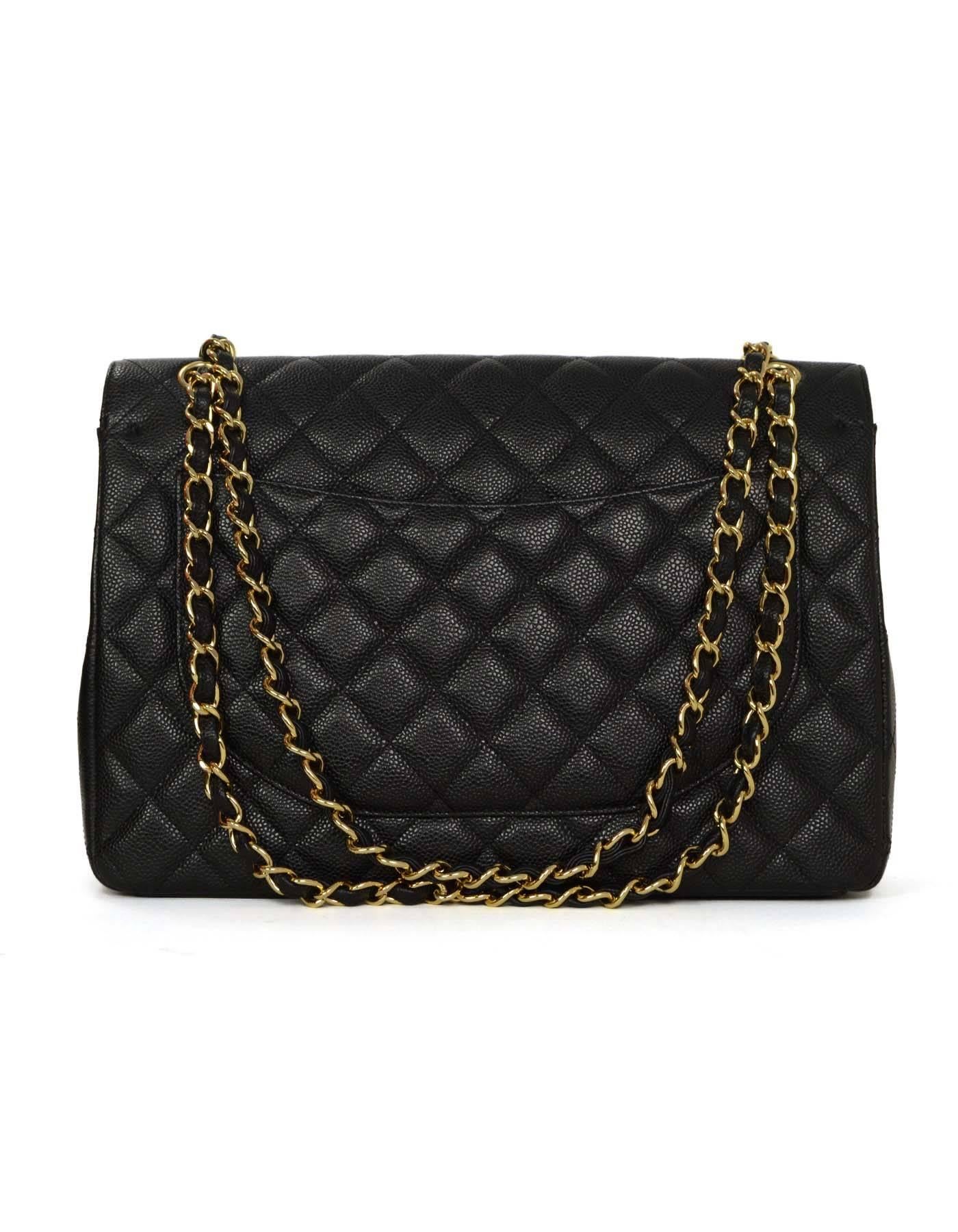 Chanel Black Classic Maxi Double Flap Bag
Features adjustable shoulder strap
Made in: Italy
Year of Production: 2011
Color: Black
Hardware: Goldtone
Materials: Caviar leather
Lining: Black and burgundy leather
Closure/opening: Double flap