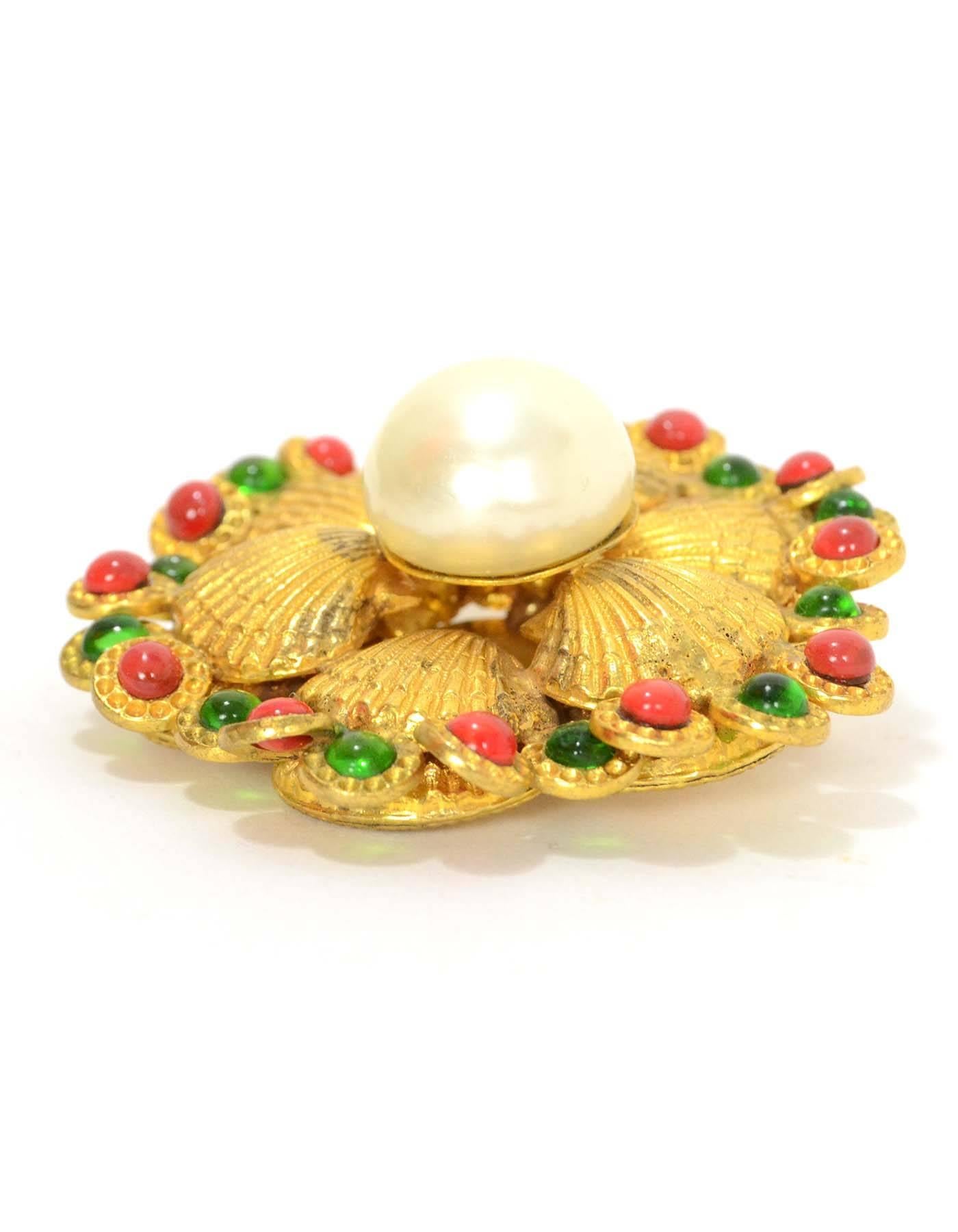 Chanel Gripoix & Pearl Gold Seashell Brooch 
Features small red and green gripoix details at outer edges of brooch with large center faux pearl
Made In: France
Year of Production: 1970's
Color: Goldtone, ivory, green and red
Materials:
