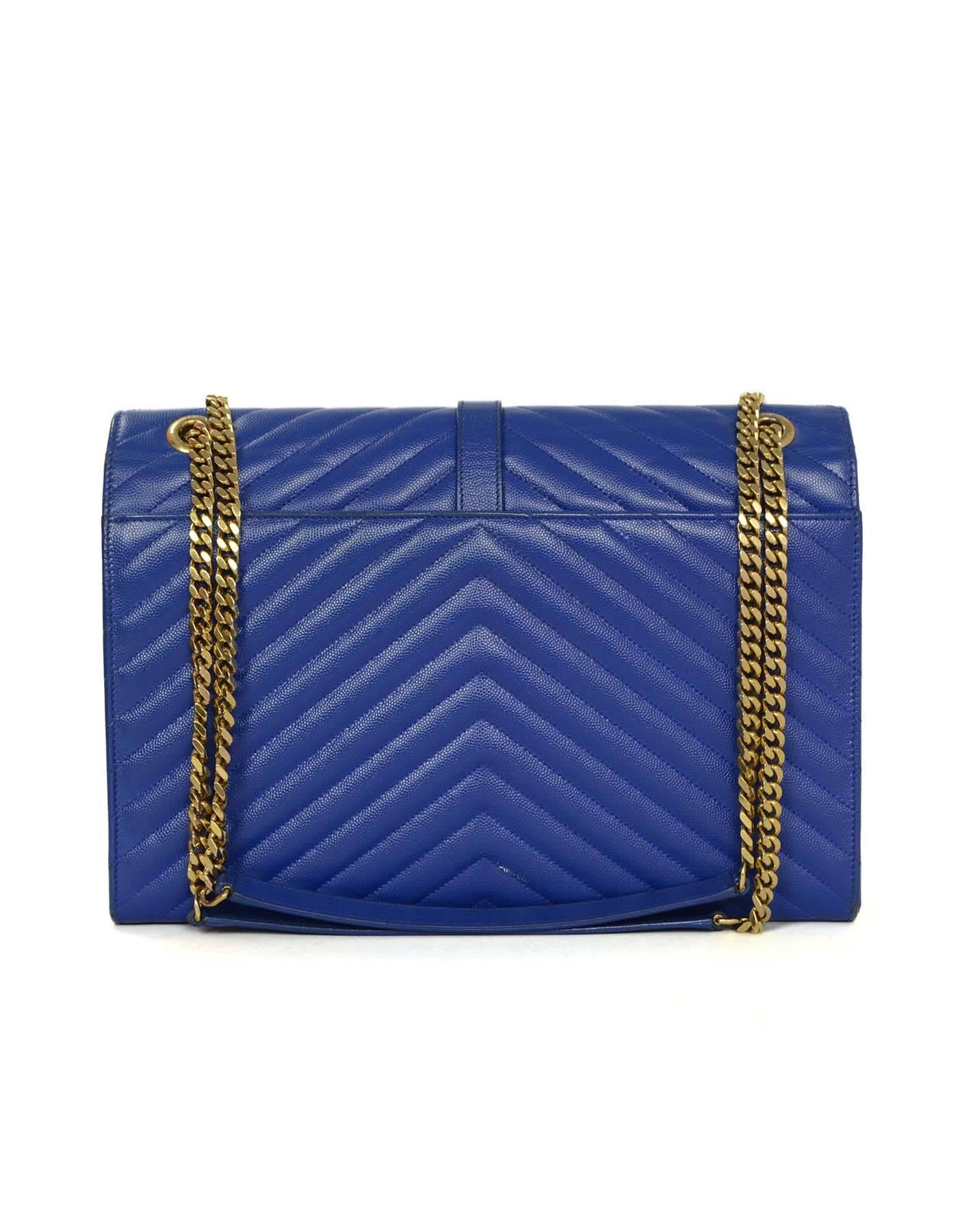 Saint Laurent Cobalt Blue Chevron Shoulder Bag
Features YSL logo medallion envelope flap with a double curb-chain strap with leather shoulder rest

Made In: Italy
Color: Cobalt blue 
Hardware: Goldtone
Materials: Caviar leather and