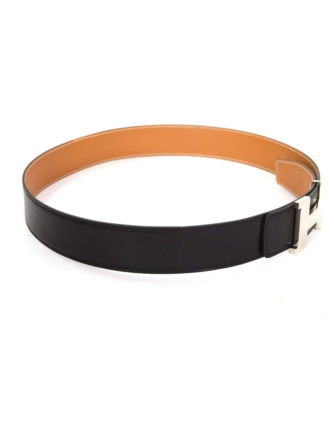 Hermes Black & Tan 42mm Palladium H Belt Kit sz 95cm
Features reversible strap

Made in: France
Year of Production: 2013
Color: Black and tan
Hardware: Palladium
Materials: Leather and metal
Serial Number/Date Stamp: Q stamp in