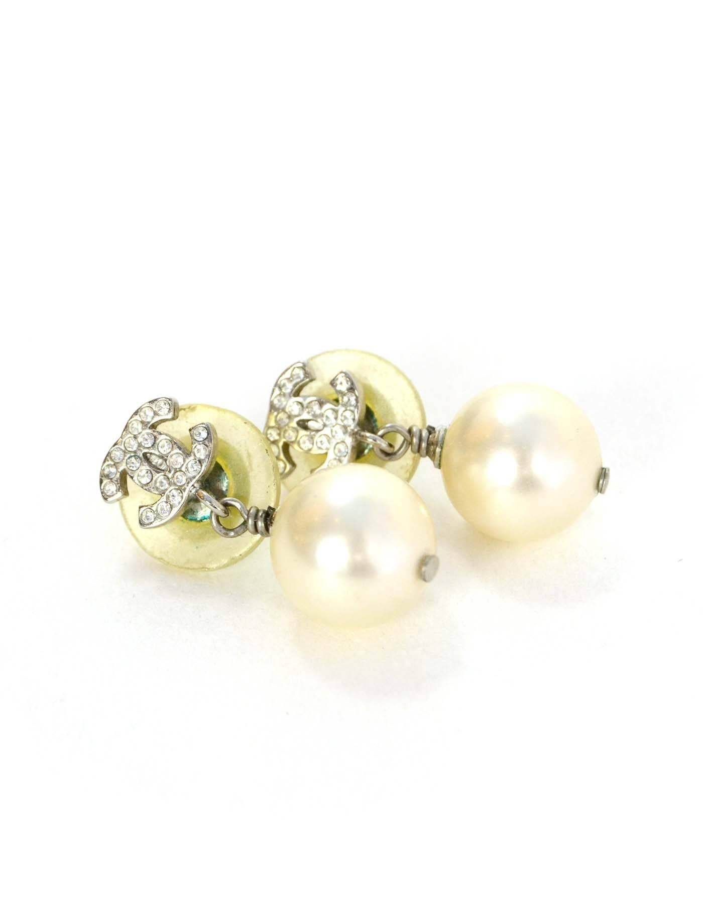 Chanel Crystal & Pearl CC Drop Earrings
Made In: Italy
Year of Production: 2007
Color: Silvertone and ivory
Materials: Metal, crystal and faux pearl
Closure: Pierced back
Stamp: 07 CC A
Overall Condition: Excellent pre-owned condition with