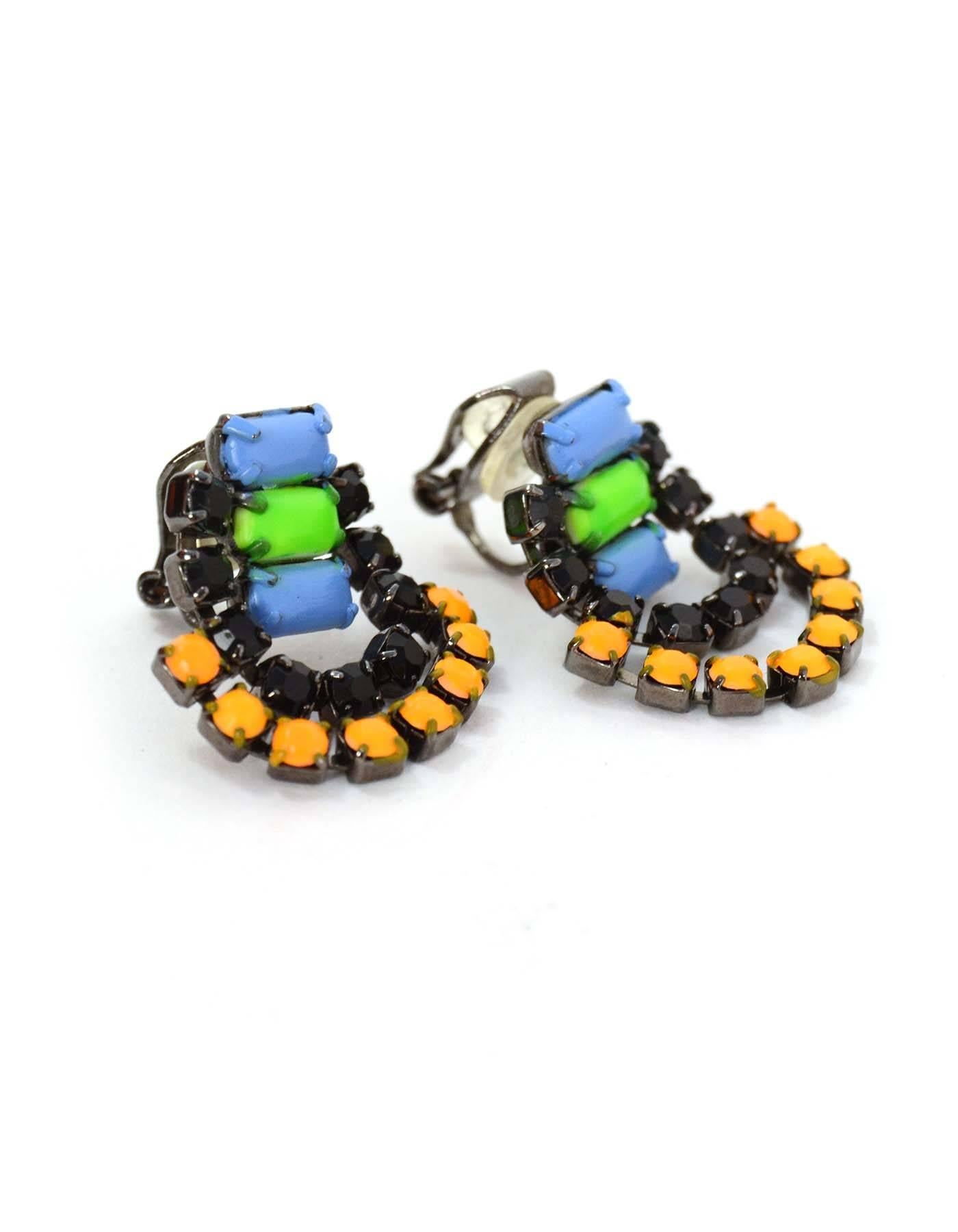 Tom Binns Multi-Colored Chandelier Clip On Earrings
Features hand-painted center section (blue and green)
Made In: U.S.A
Color: Black, neon orange, blue, green, and gunmetal
Hardware: Gunmetal
Materials: Metal and crystal
Closure: Clip