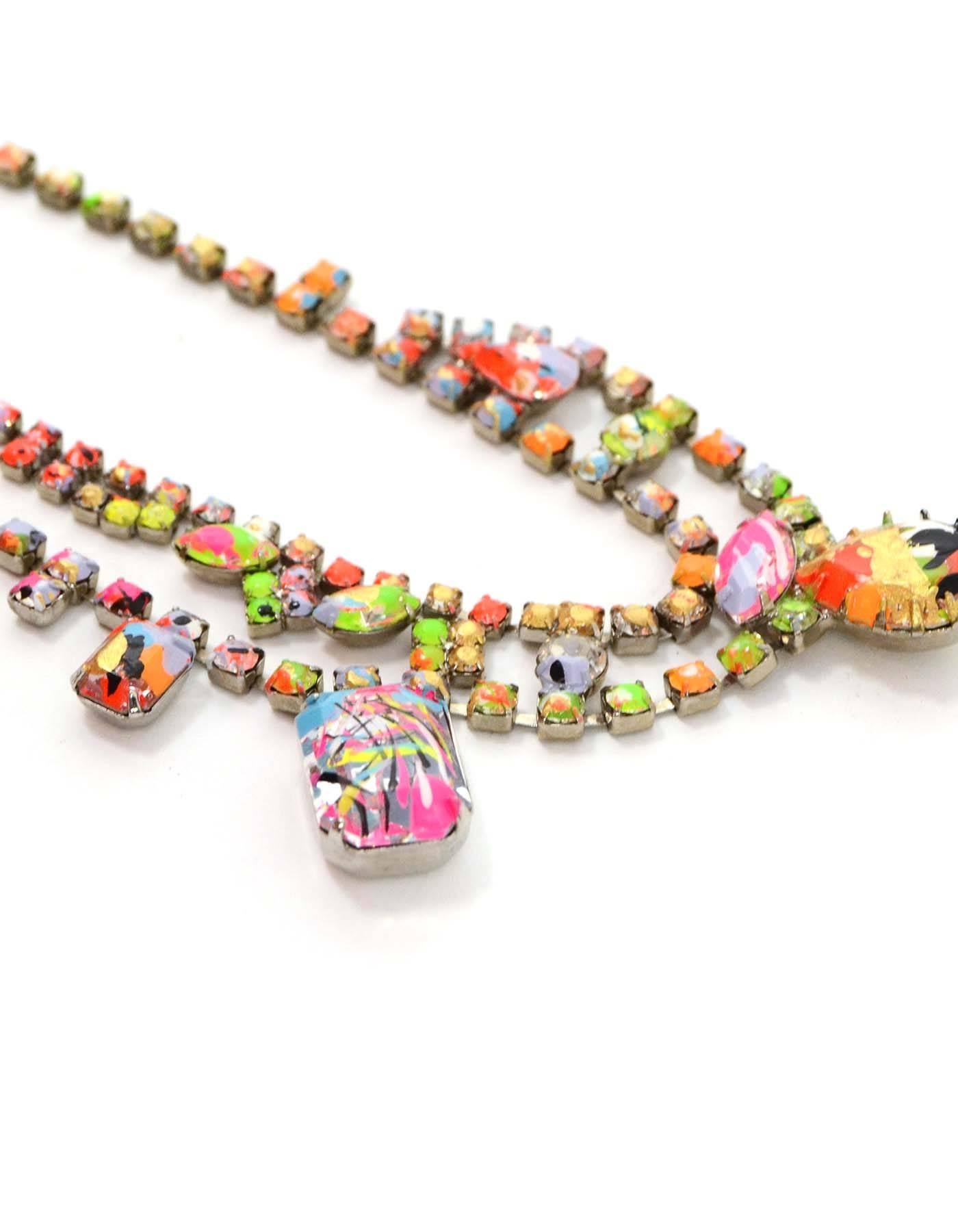 Tom Binns Multi-Color Asymmetrical Bib Necklace 
Features hand-painted paint splatters throughout necklace
Made In: U.S.A
Color: Multi-colored
Materials: Metal and crystal
Closure: Push lever clasp
Stamp: Tom Binns Made in USA
Overall