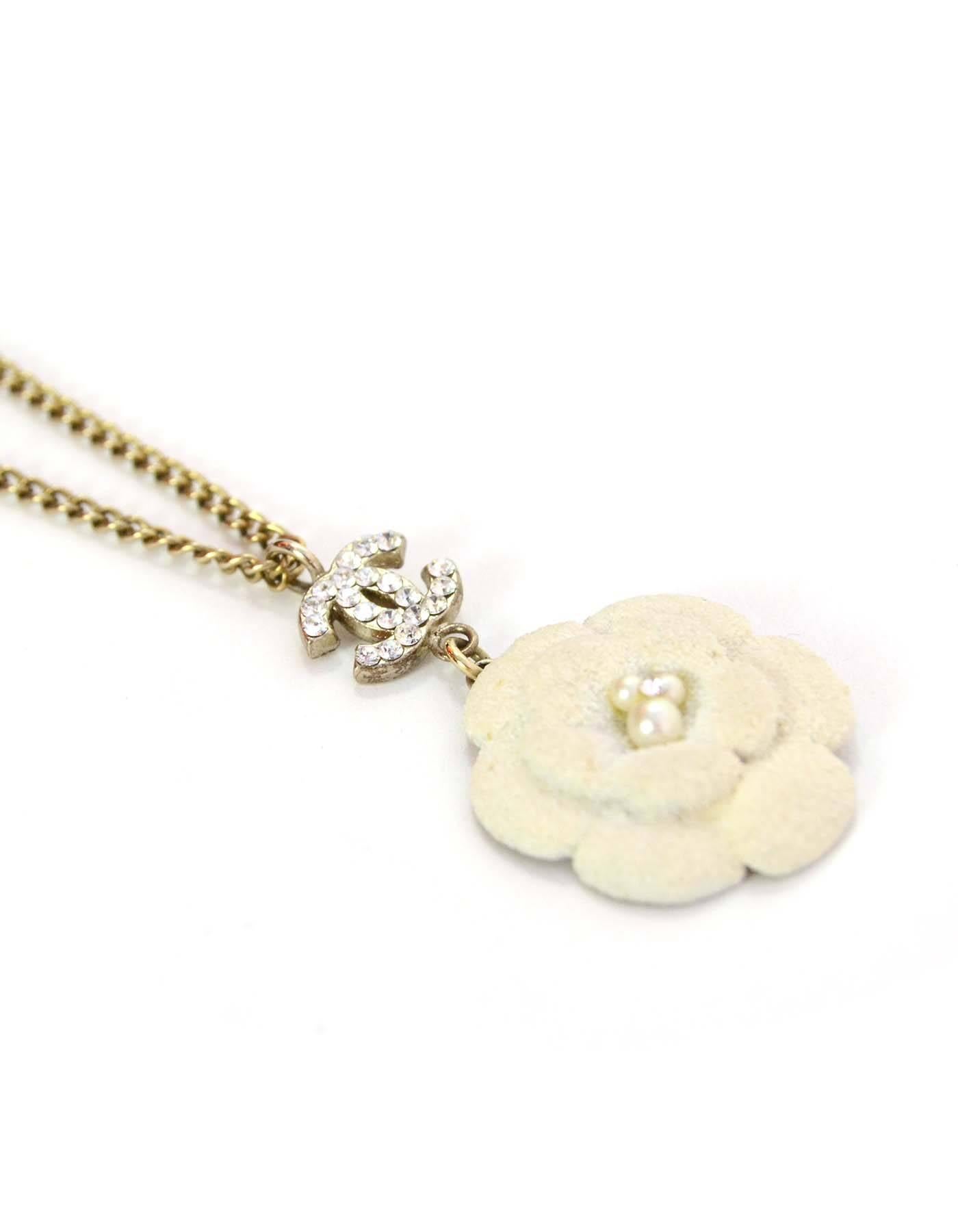 Chanel White Textured Camelia Pendant Necklace
Features crystal CC above flower and three faux pearls and one crystal in flower center
Made In: France
Year of Production: 2005
Color: Silvertone and white
Materials: Metal, textured metal,