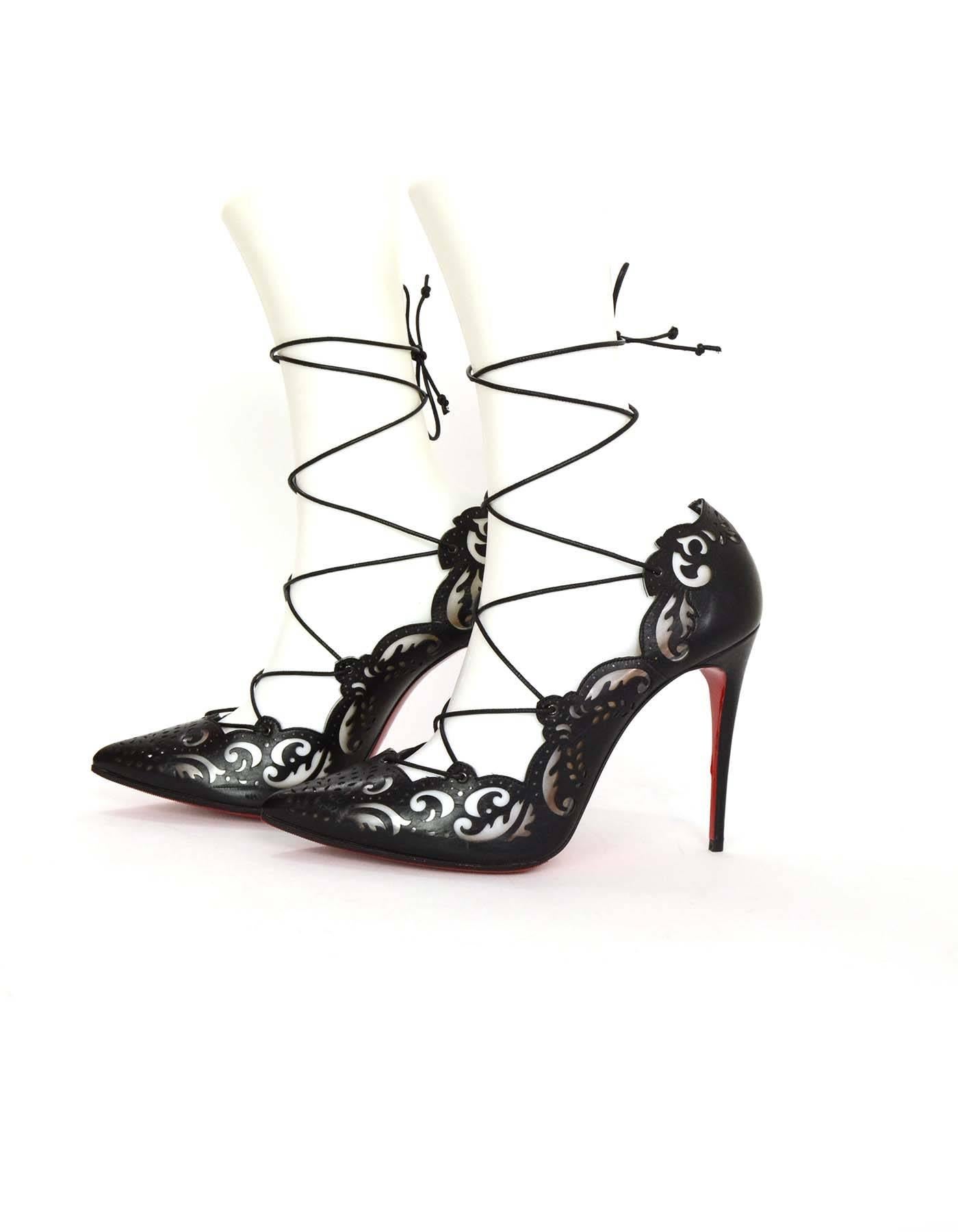Christian Louboutin Laser Cut Impera 100mm Lace Up Pumps

Made In: Italy
Color: Black
Materials: Leather
Closure/Opening: Lace up tie
Sole Stamp: Christian Louboutin Made In Italy 39 1/2
Retail Price: $1,295 + tax
Overall Condition: