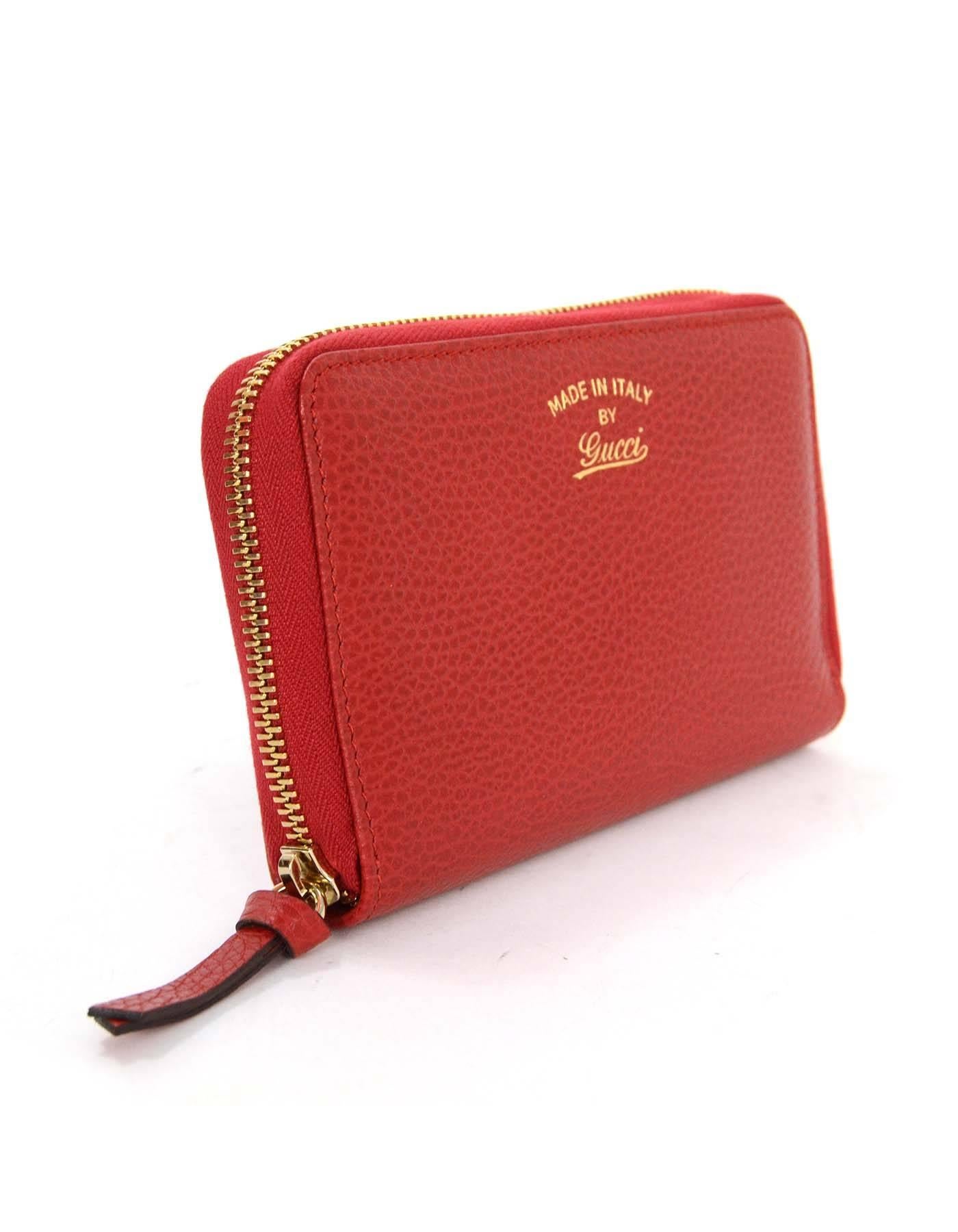 Gucci Red Leather Swing Zippy Wallet 
Features 