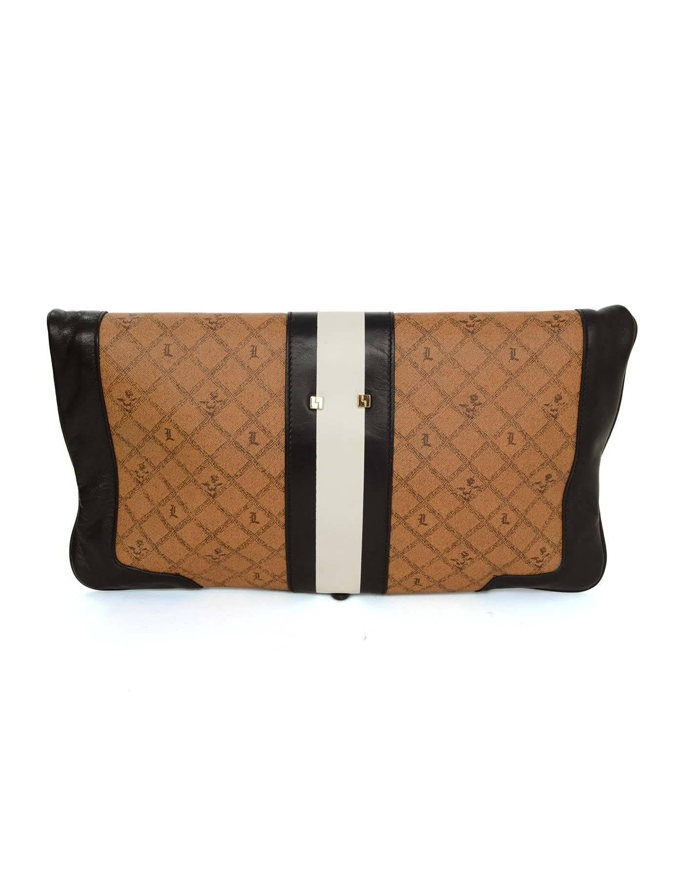 LAMB Black & Tan Monogram Clutch 
Can be worn as a clutch or a handle bag
Made In: China
Color: Tan, black and white
Hardware: Goldtone
Materials: Coated canvas and leather
Lining: Black and white stripe canvas
Closure/Opening: Magnetic snap