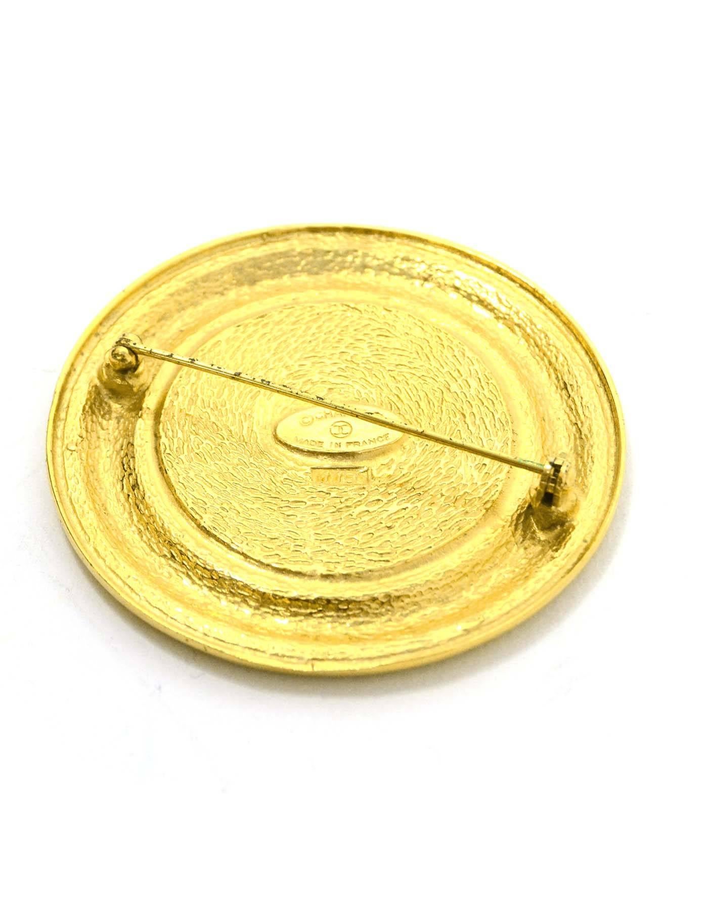Chanel Vintage Gold Coin Brooch 
Features columns and a door with 