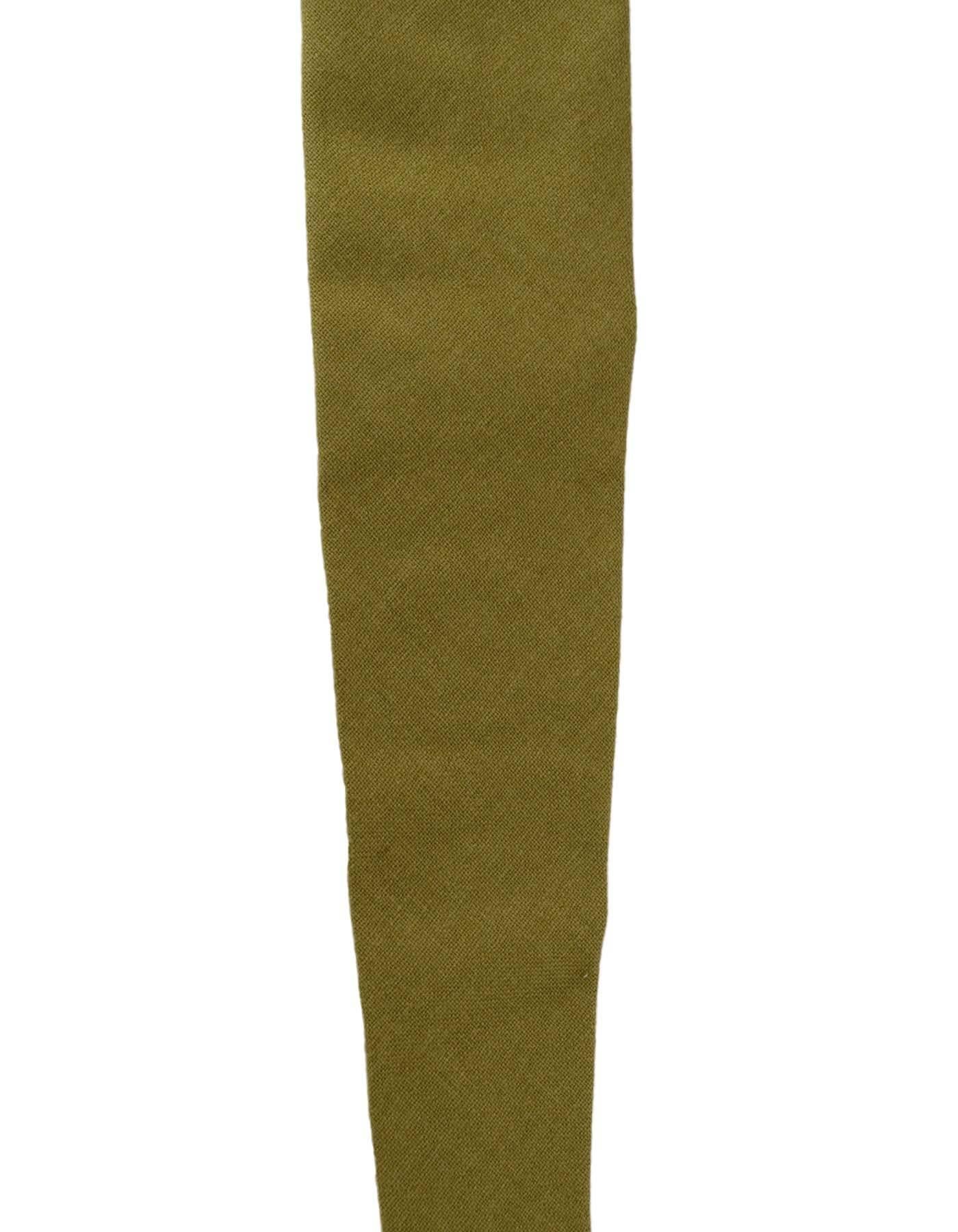 Hermes Khaki Green Cashmere Tie
Made In: France
Color: Khaki green
Composition: 100% Cashmere
Overall Condition: Excellent pre-owned condition
Measurements: 
Length:61.5