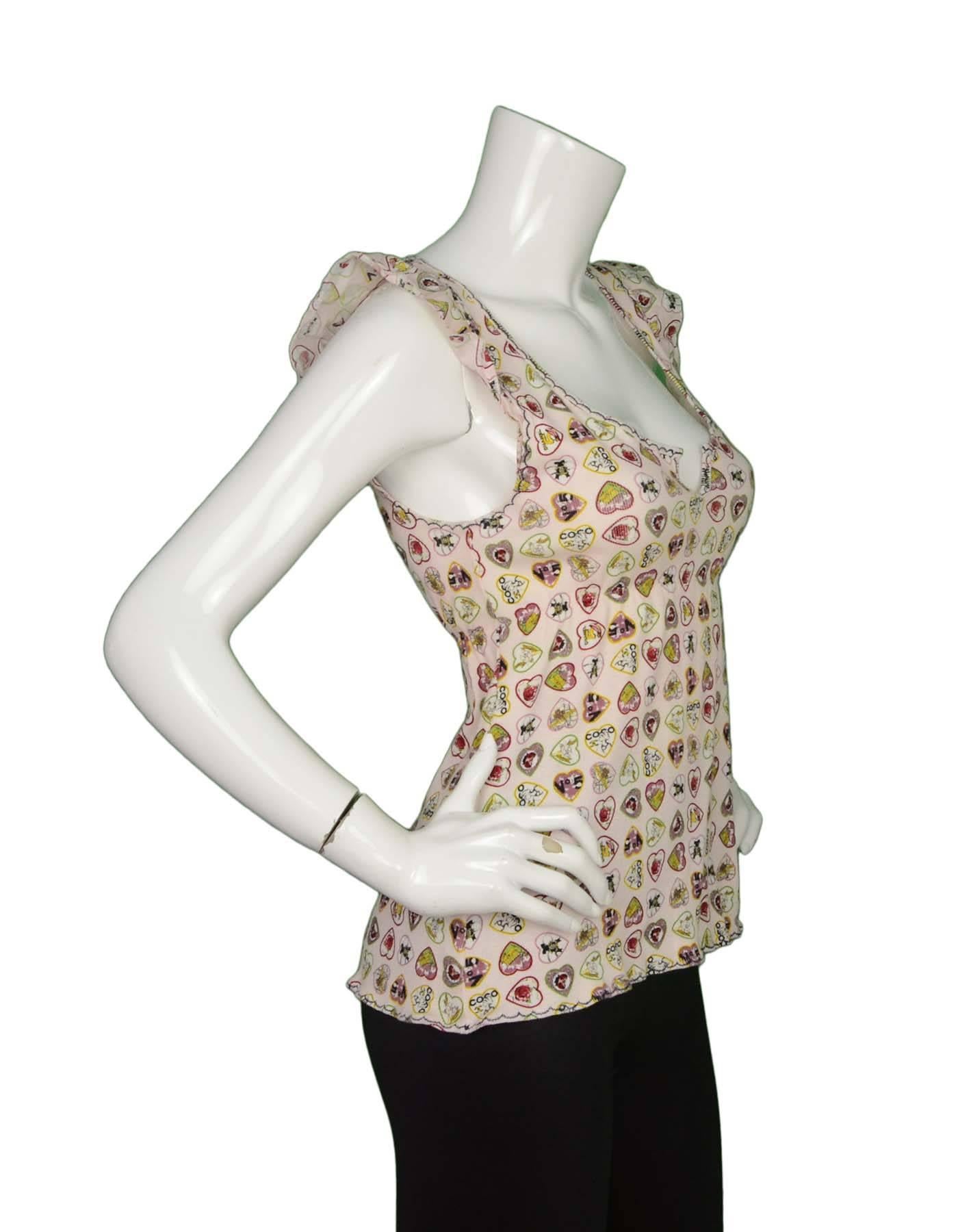Chanel Coco Heart Print Ribbed Cotton Top 
Features elastic at waist for empire-waist look
Made In: Italy
Color: Light pink, red, yellow, black and white
Composition: 95% cotton, 5% spandex
Lining: None
Closure/Opening: Pull over
Exterior