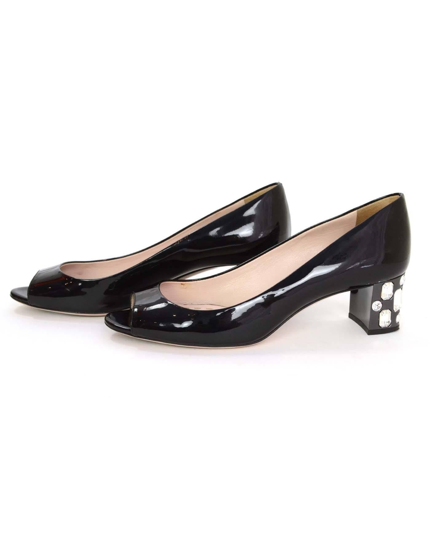 Miu Miu Black Patent Peep-Toe Block Heel Pumps 
Features different shaped crystals detailing block heel
Made In: Italy
Color: Black
Materials: Patent leather and crystal
Closure/Opening: Slide on
Sole Stamp: Miu Miu Made in Italy 37