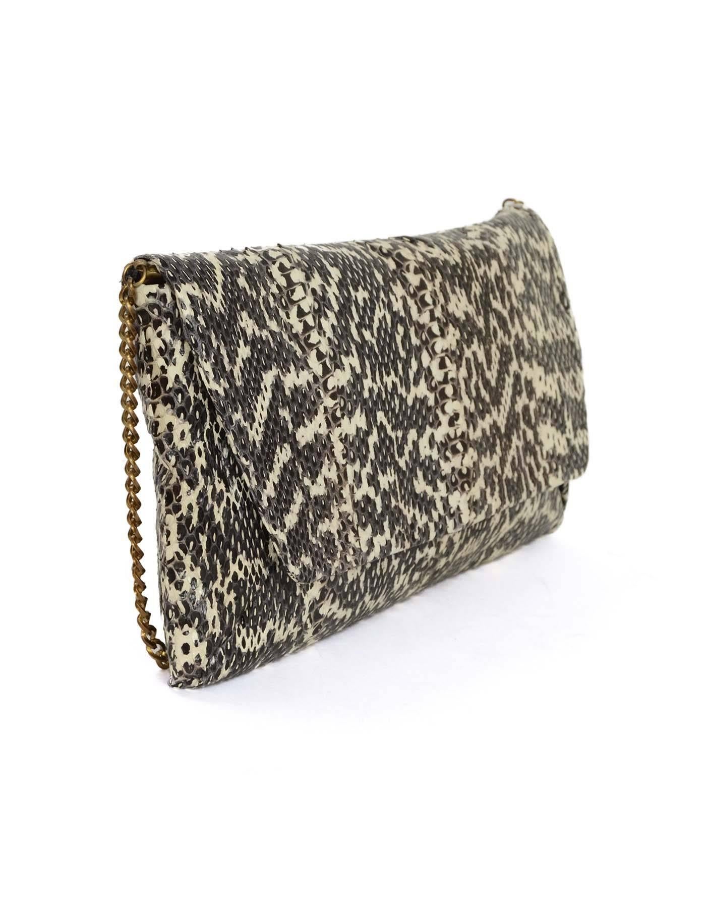 Lanvin Black & Ivory Embossed Snakeskin Clutch 
Features optional chain link shoulder strap
Made In: Italy
Color: Black and ivory
Hardware: Bronze
Materials: Snakeskin embossed leather
Lining: Charcoal satin and black
