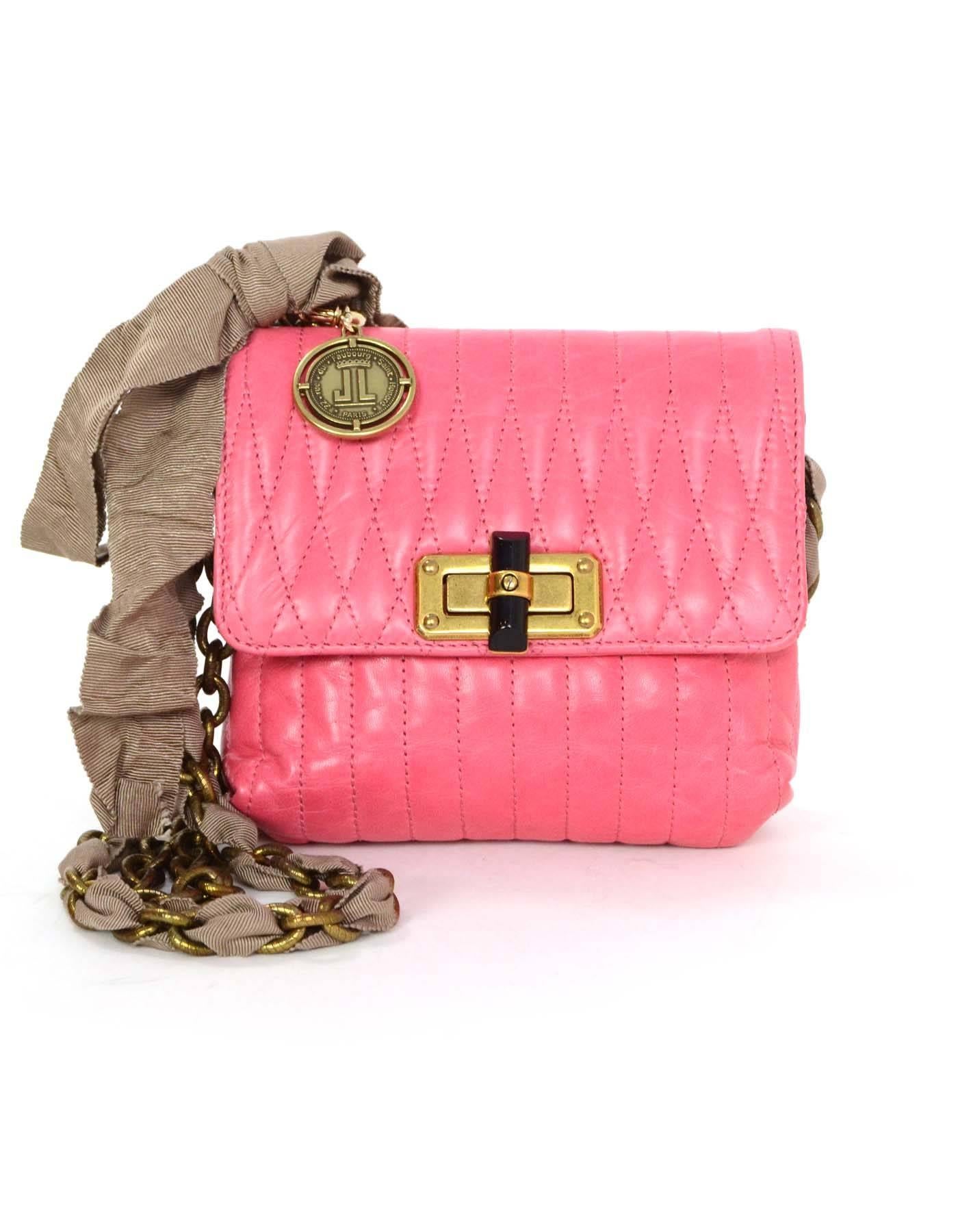 Lanvin Pink Leather Happy Crossbody Bag 
Features grosgrain ribbon woven through one side of chain link strap
Made In: Italy
Color: Pink
Hardware: Bronze
Materials: Leather and metal
Lining: Navy Lanvin printed textile
Closure/Opening: Flap