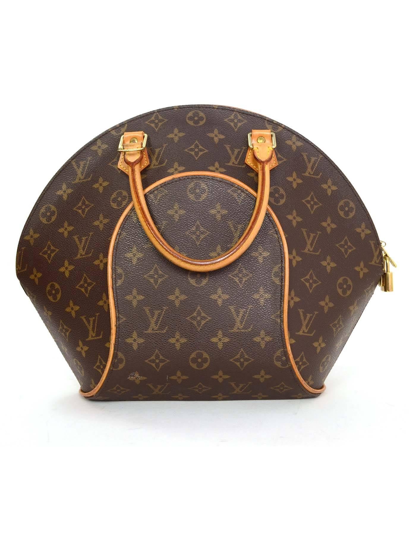 Louis Vuitton Monogram Ellipse MM Bag 
Features optional shoulder/crossbody strap
Made In: U.S.A.
Year of Production: 2000
Color: Brown and tan
Hardware: Goldtone
Materials: Leather and coated canvas
Lining: Brown canvas
Closure/Opening: