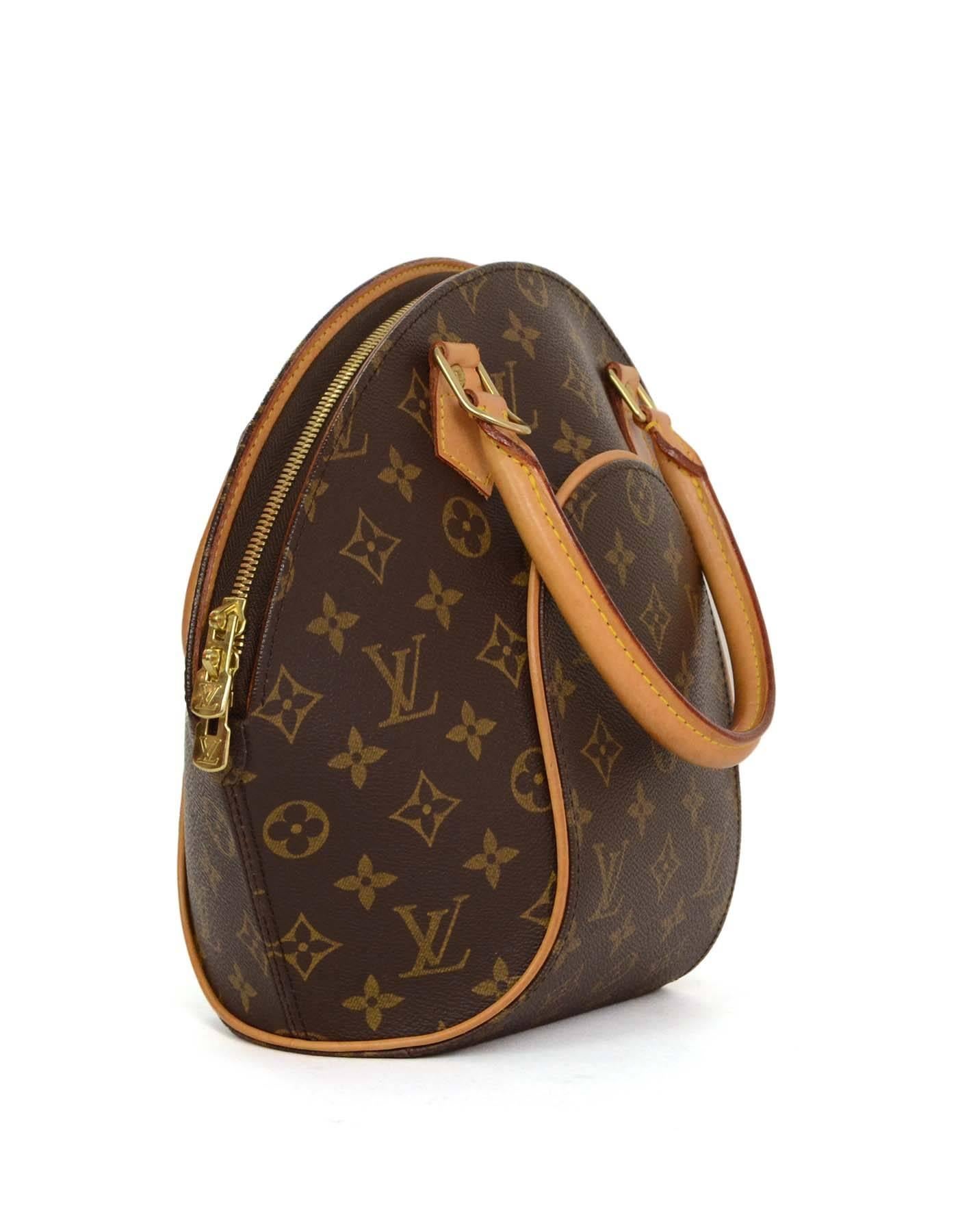 Louis Vuitton Monogram Ellipse PM Bag 
Features leather rolled handles and leather piping throughout
Made In: U.S.A.
Year of Production: 2003
Color: Brown and tan
Hardware: Goldtone
Materials: Leather and coated canvas
Lining: Brown