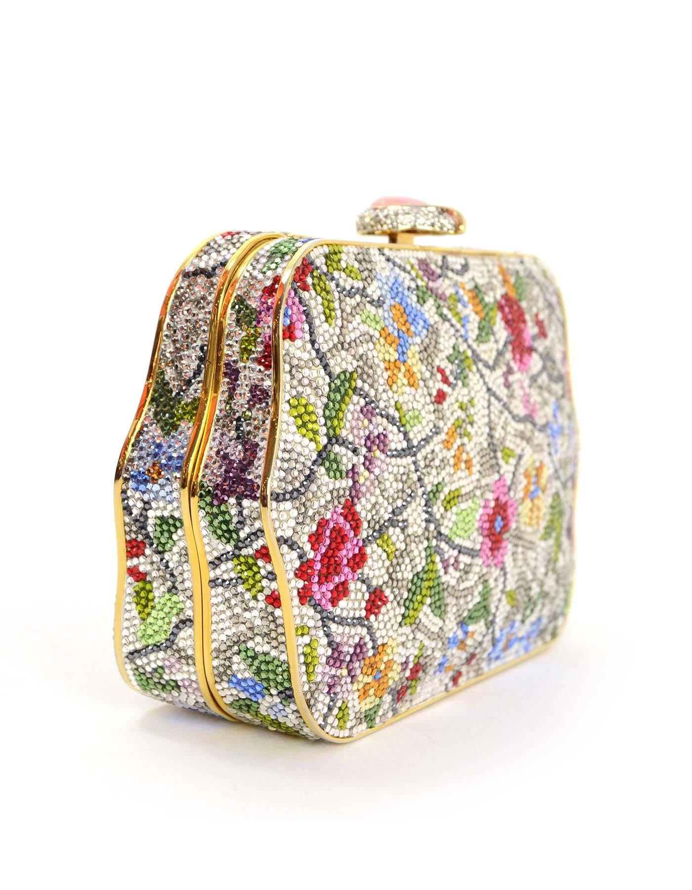 Judith Leiber Multi-Colored Floral Crystal Embellished Minaudiere
Features hidden goldtone chain link shoulder strap
Made In: Italy
Color: Goldtone, red, pink, green, orange,yellow, blue, purple, and grey
Hardware: Goldtone
Materials: Metal and