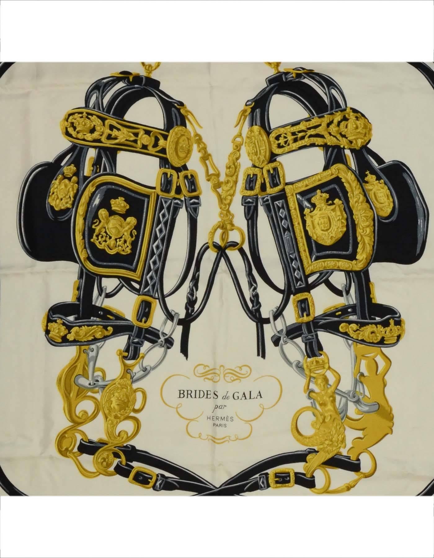 Hermes Navy & Ivory Brides De Gala 90cm Silk Scarf
Features equestrian theme printed throughout

Made In: France
Color: Ivory, gold and navy
Composition: 100% silk
Overall Condition: Excellent pre-owned condition with the exception of one