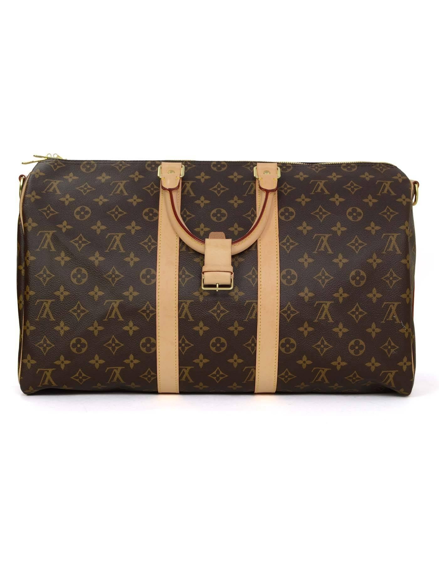 Louis Vuitton Monogram Keepall Bandouliere 45
Features optional shoulder/crossbody strap
Made In: USA
Year of Production: 2016
Color: Brown and tan
Hardware: Goldtone
Materials: Coated canvas and leather
Lining: Brown canvas
Closure/Opening: