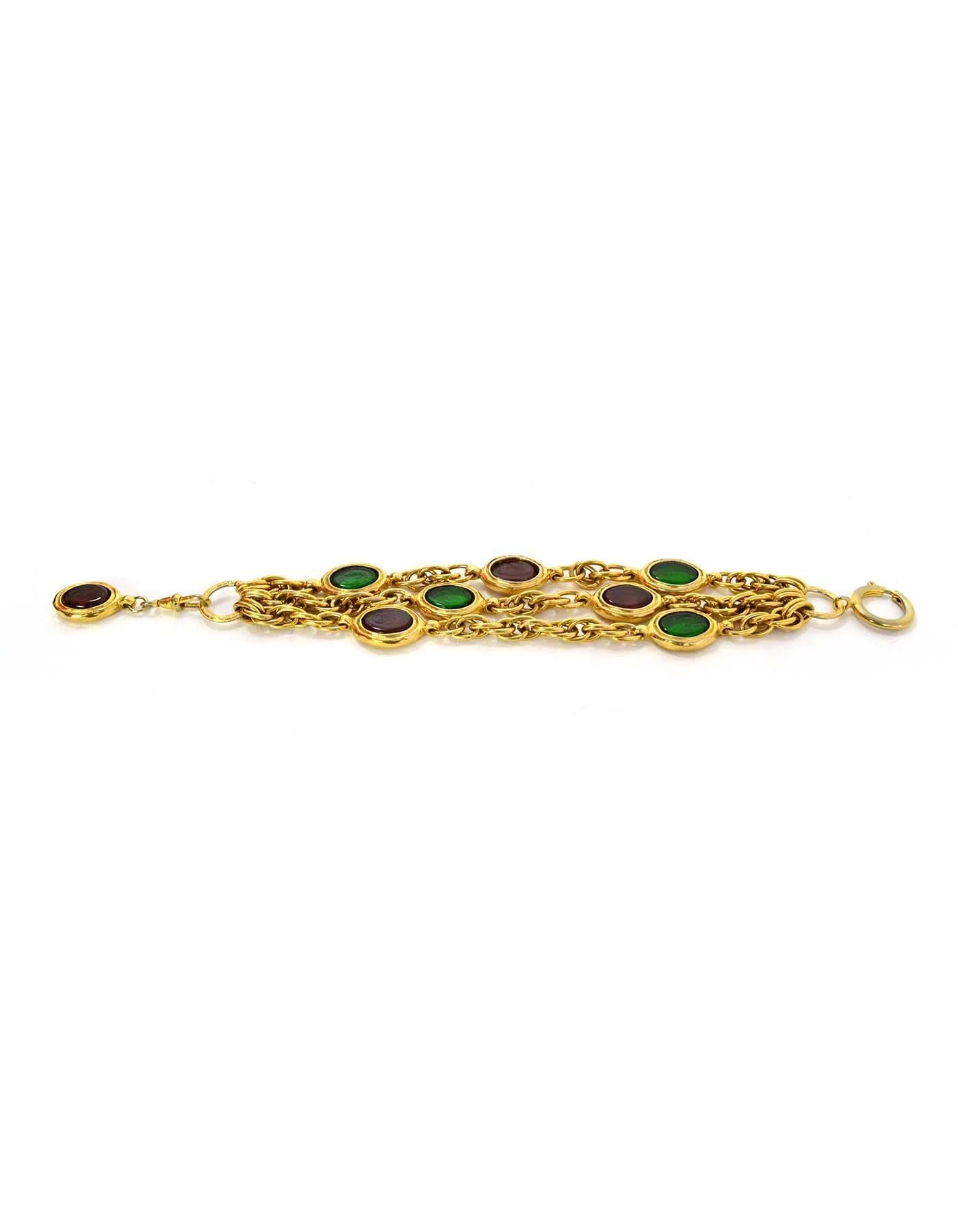 Chanel Gripoix & Goldtone Multi-Strand Bracelet

Made In: France
Year of Production: 1970s
Color: Red, green, and goldtone
Materials: Metal and gripoix
Closure: Jump ring closure
Stamp: Chanel CC Made in France
Overall Condition: Excellent