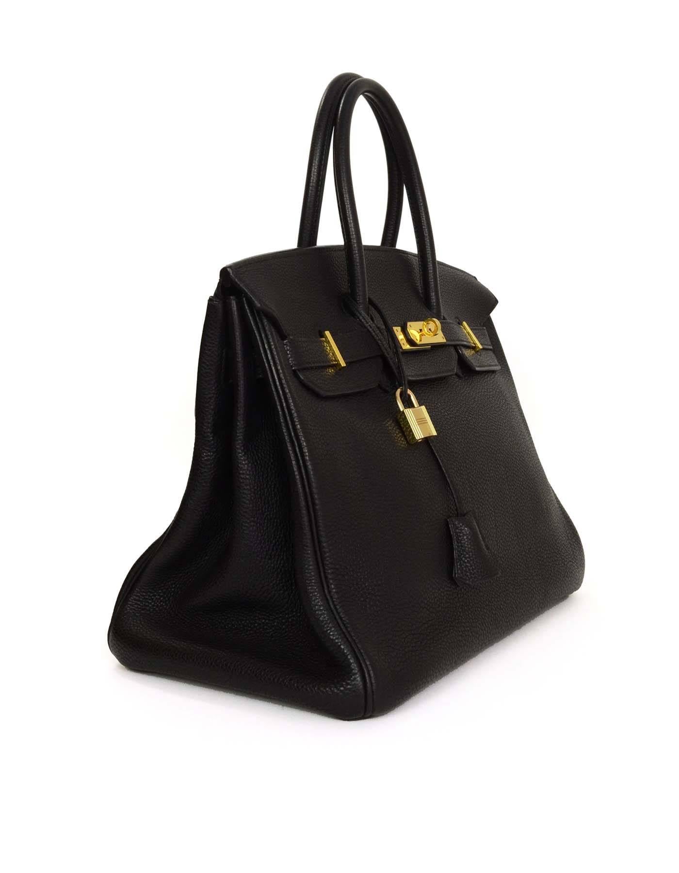 Hermes Black Togo 35cm Birkin Bag
Made In: France
Year of Production: 2005
Color: Black
Hardware: Goldtone
Materials: Togo leather
Lining: Black chevre leather
Closure/Opening: Flap top with two leather arms that come together at twist lock