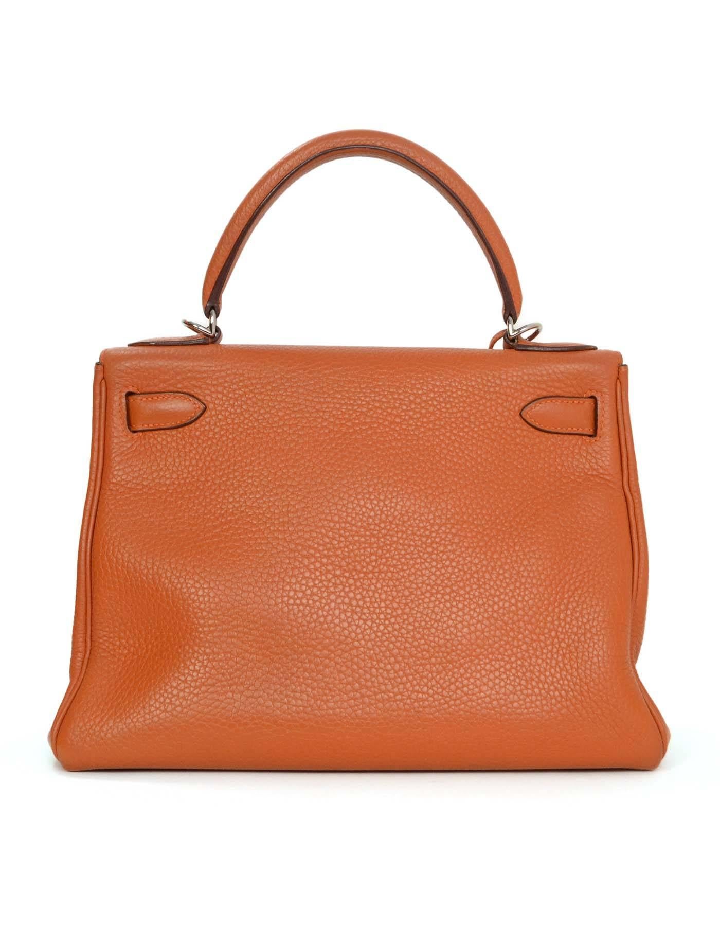 Hermes Orange Clemence 28cm Kelly Bag 
Features removable shoulder/crossbody strap
Made in: France
Year of Production: 2004
Color: Orange
Hardware: Palladium
Materials: Clemence leather
Lining: Orange chevre leather
Closure/opening: Flap top