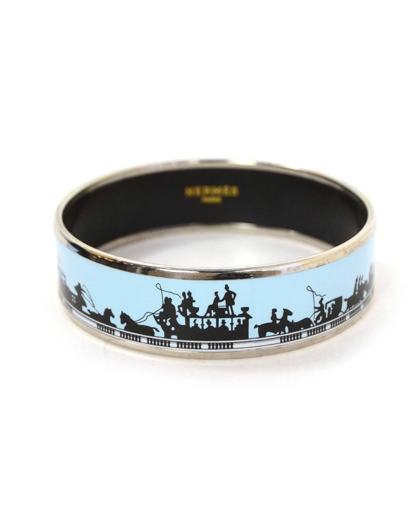 Hermes Blue and Black Printed Enamel Bangle Sz 65
Features blue and black horse and carriage design.

Made In: Austria
Color: Blue, black and palladium
Materials: Metal and enamel
Closure: None
Stamp: Hermes Paris Made in Austria + K
Retail