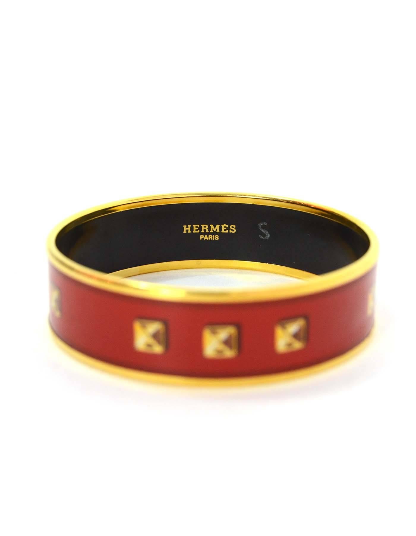 Hermes Red and Gold-Plated Enamel Bangle Sz 65

Features stud design throughout.

Made In: Austria
Color: Red and gold-plated
Materials: Metal and enamel
Closure: None
Stamp: Hermes Paris Made in Austria + L
Retail Price: $550 +