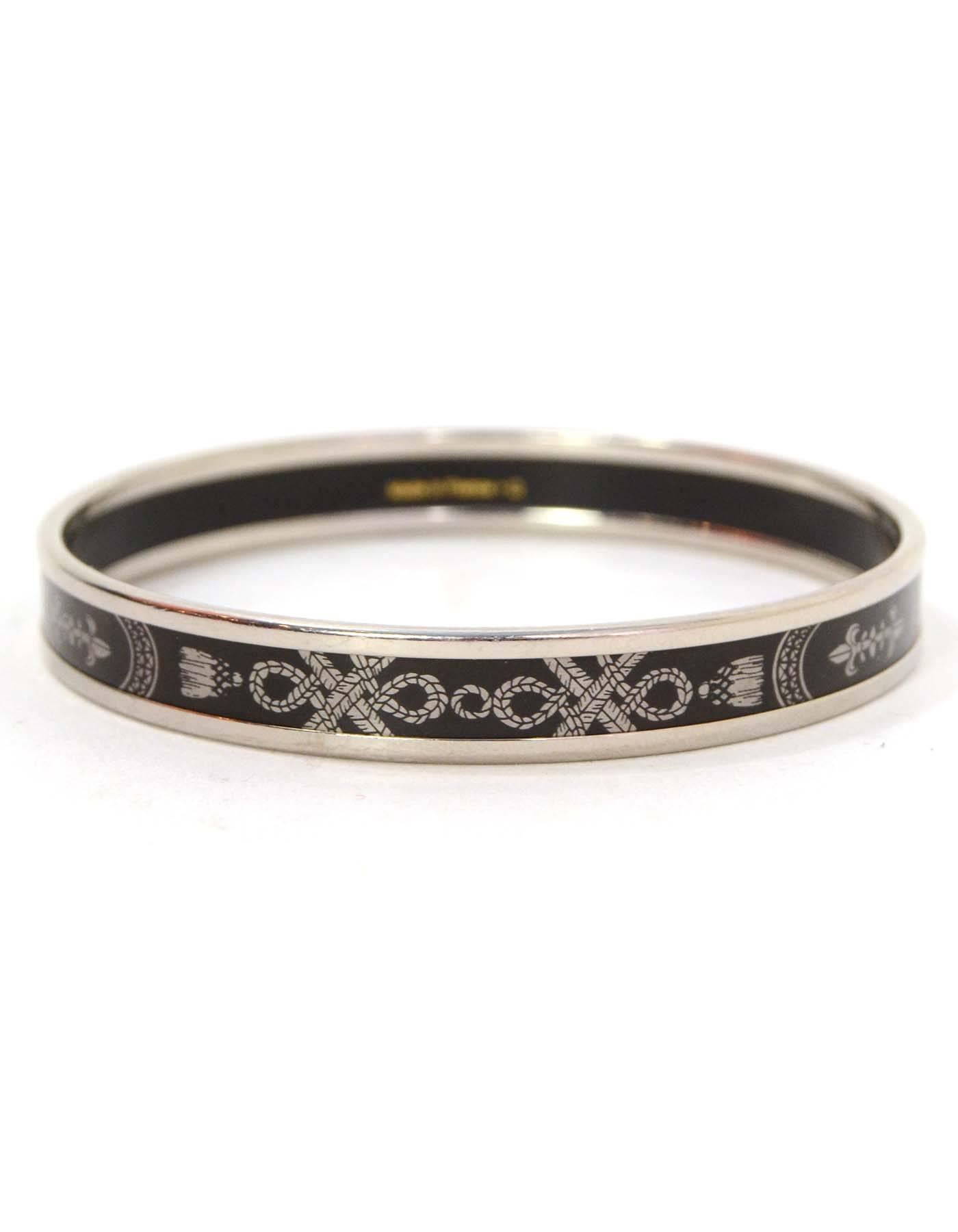 Hermes Black and Palladium Narrow Enamel Bracelet Sz 65
Features rope deisgn throughout

Made In: France
Color: Black and palladium
Materials: Metal and enamel
Closure: None
Stamp: Hermes Paris Made in France + Q
Retail Price: $510 +