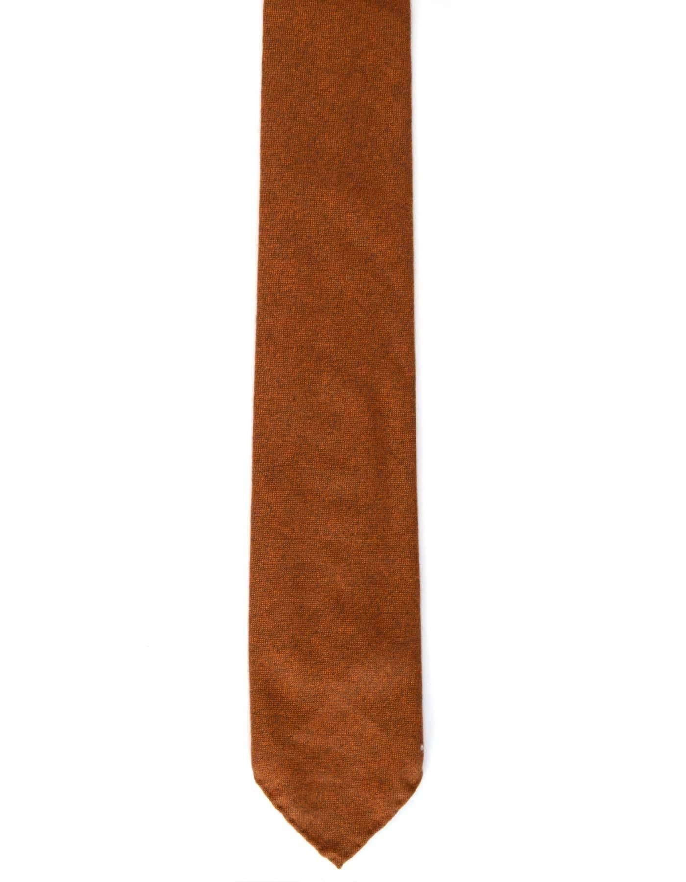 Hermes Burnt Orange Cashmere Tie
Made In: France
Color: Burnt orange
Composition: 100% cashmere
Overall Condition: Excellent pre-owned condition
Measurements: 
Length: 62