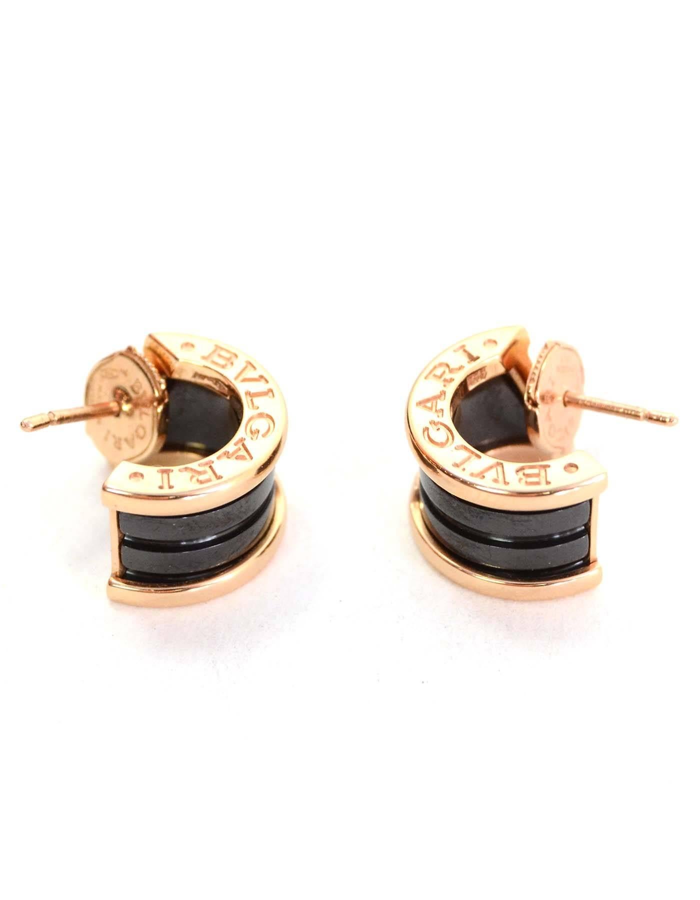 Bvlgari B.zero1 18k Pink Gold Earrings

Features black ceramic, engraved logo and push-back closure.

Year of Production: 2015
Color: Pink and black
Materials: 18k pink gold and ceramic
Closure: Push-back
Stamp: BVLGARI Made in Italy
