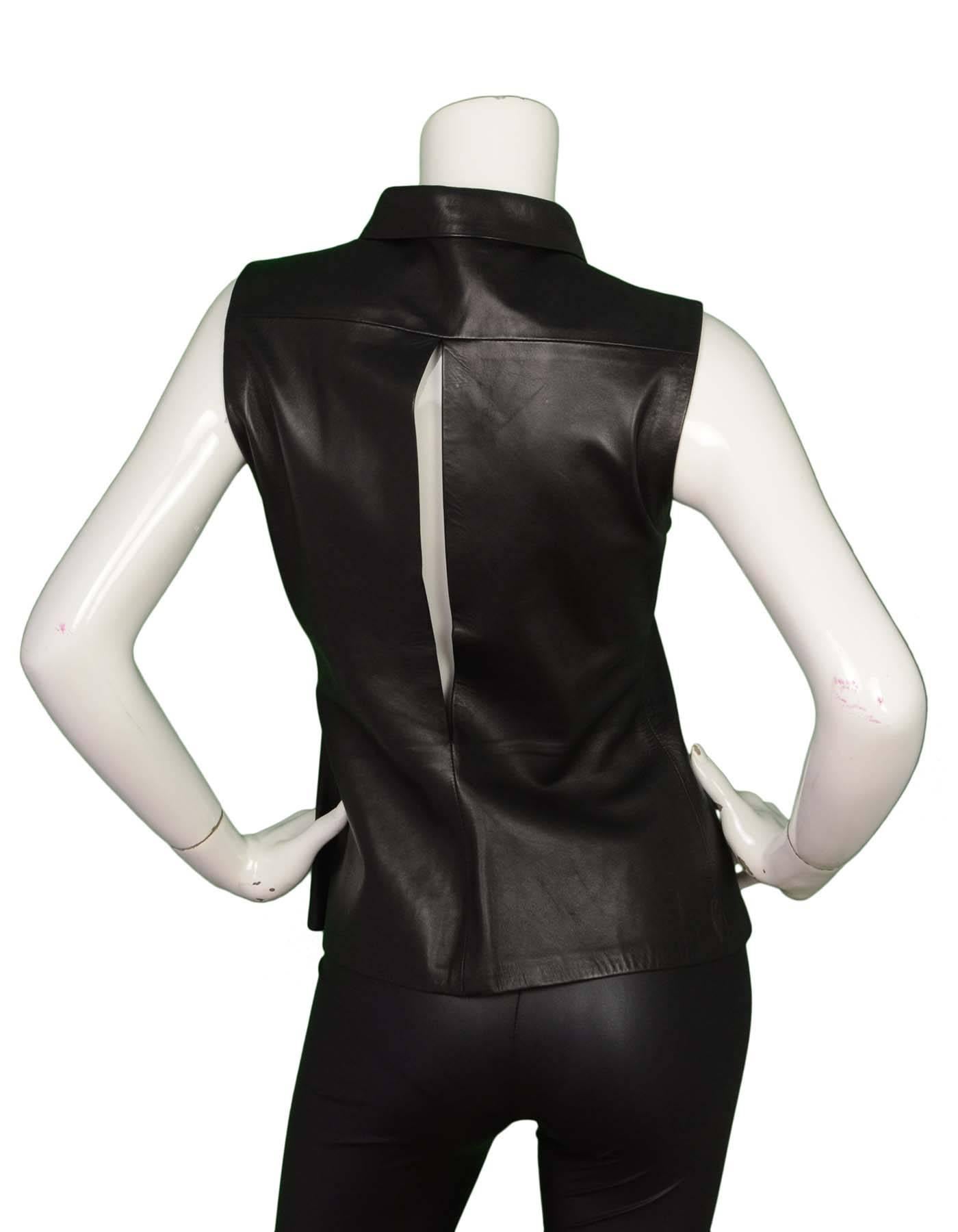 Jil Sander Black Leather Vest Sz 38
Features slit opening at back

Color: Black
Composition: 100% leather
Lining: None
Closure/Opening: Front button closure
Exterior Pockets: None
Interior Pockets: None
Overall Condition: Very good