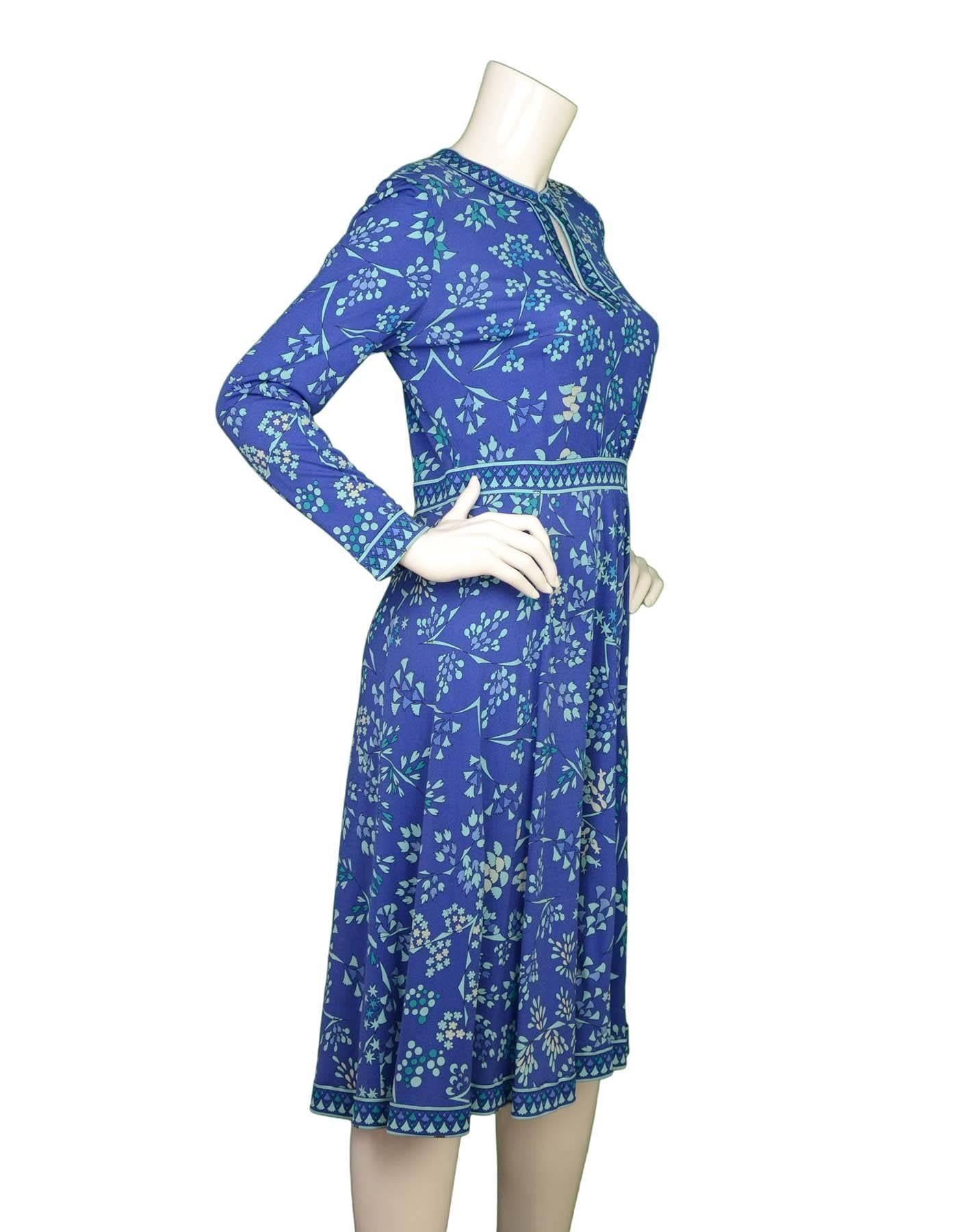 Bessi Blue Floral Print Silk Long Sleeve Dress 
Features optional key-hole neckline with top button closure

Made In: Italy
Color: Blue, teal and turquoise
Composition: 100% silk
Lining: None
Closure/Opening: Back center zipper
Exterior
