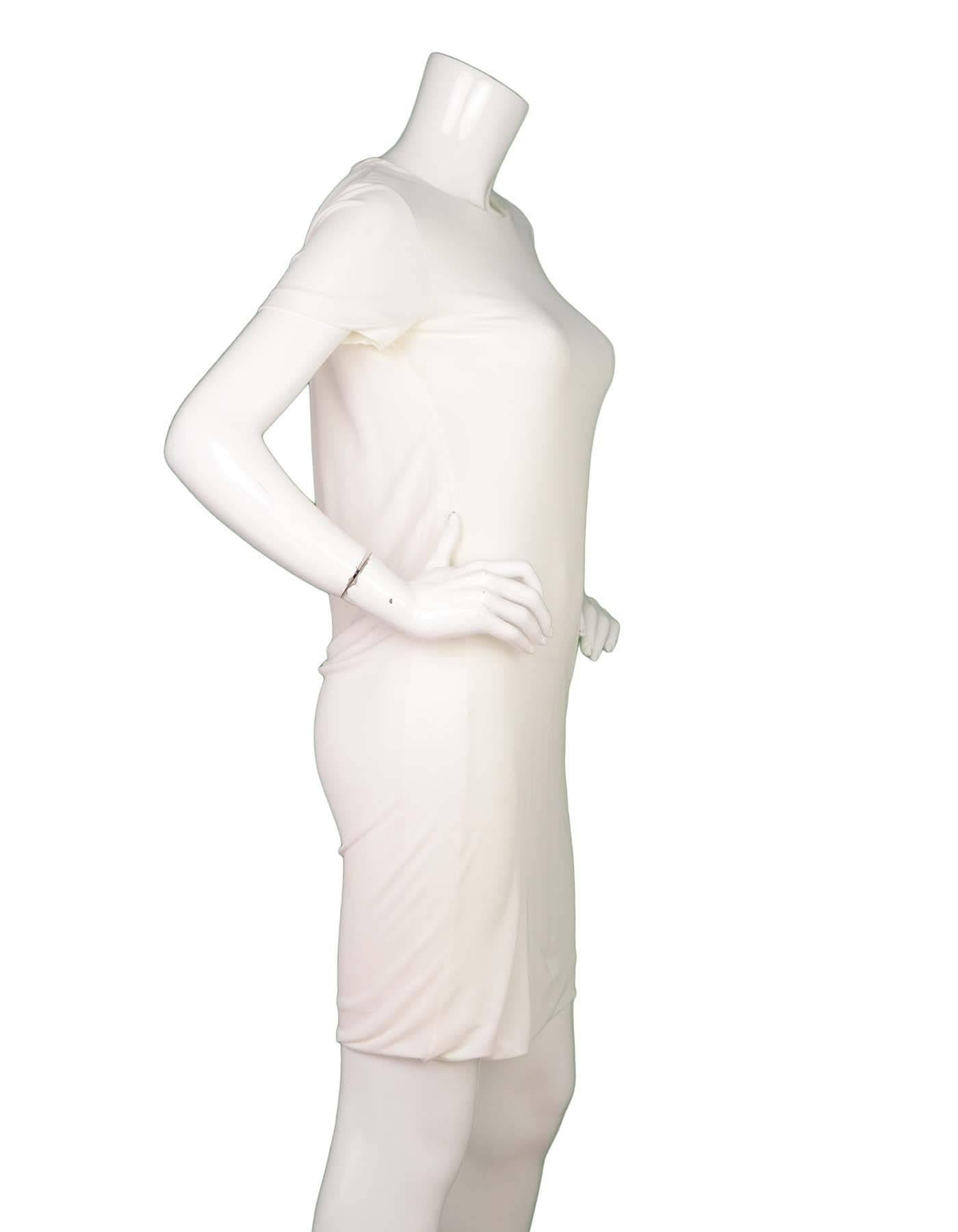 Gucci Off-White Short Sleeve Sheath Dress 
Features draping in back of dress
Made In: Italy
Color: Off-white
Composition: 100% viscose
Lining: Off-white, 65% acetate, 35% polyamide
Closure/Opening: Pull over with goldtone button at back