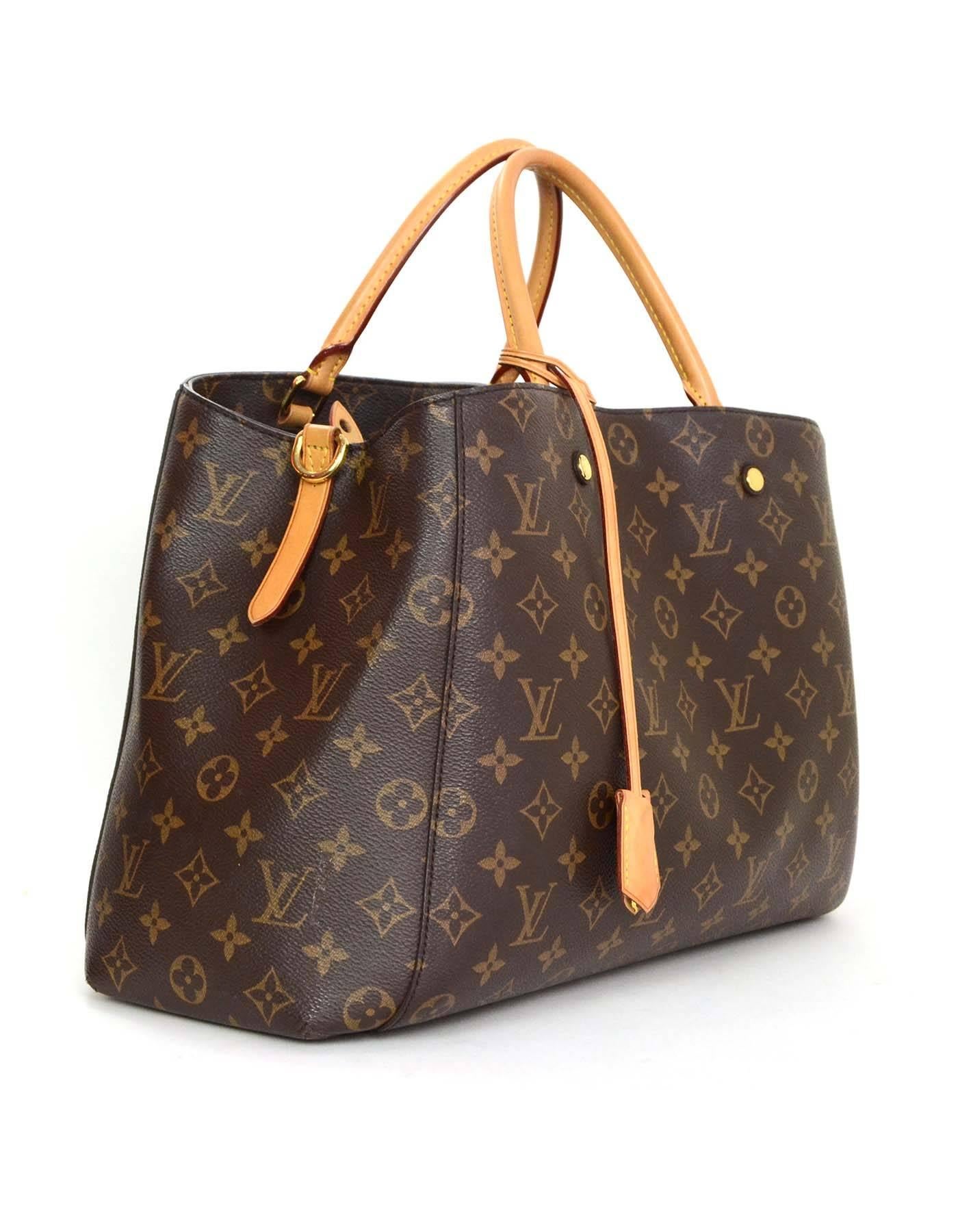 Louis Vuitton Monogram Montaigne GM Bag

Features removable monogram shoulder strap and lock, key and clochette

    Made In: U.S.A
    Year of Production: 2014
    Materials: Canvas and leather
    Lining: Burgundy microfiber
    Hardware: