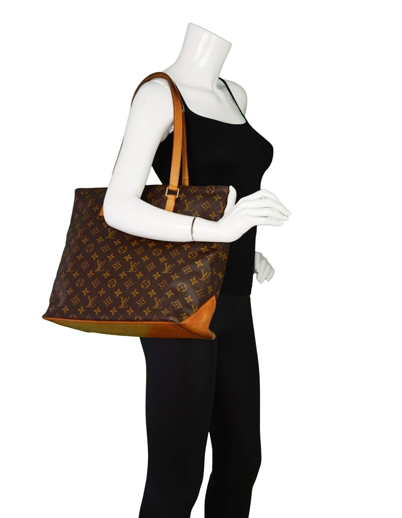 Louis Vuitton Monogram Cabas Alto Tote

Made In: France
Year of Production: 2006
Color: Brown
Materials: Coated canvas and vachetta leather
Lining: Brown textile
Hardware: Gold-tone
Closure: Zip top
Serial Number/Date Code: AR0036
Exterior