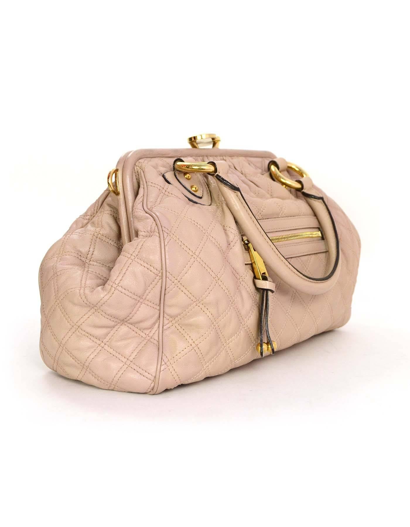 Marc Jacobs Blush Quilted Leather Stam Bag
Features optional chain link shoulder strap
Made In: Italy
Color: Blush
Hardware: Goldtone
Materials: Leather 
Lining: Beige canvas
Closure/Opening: Frame bag-style opening with kiss lock